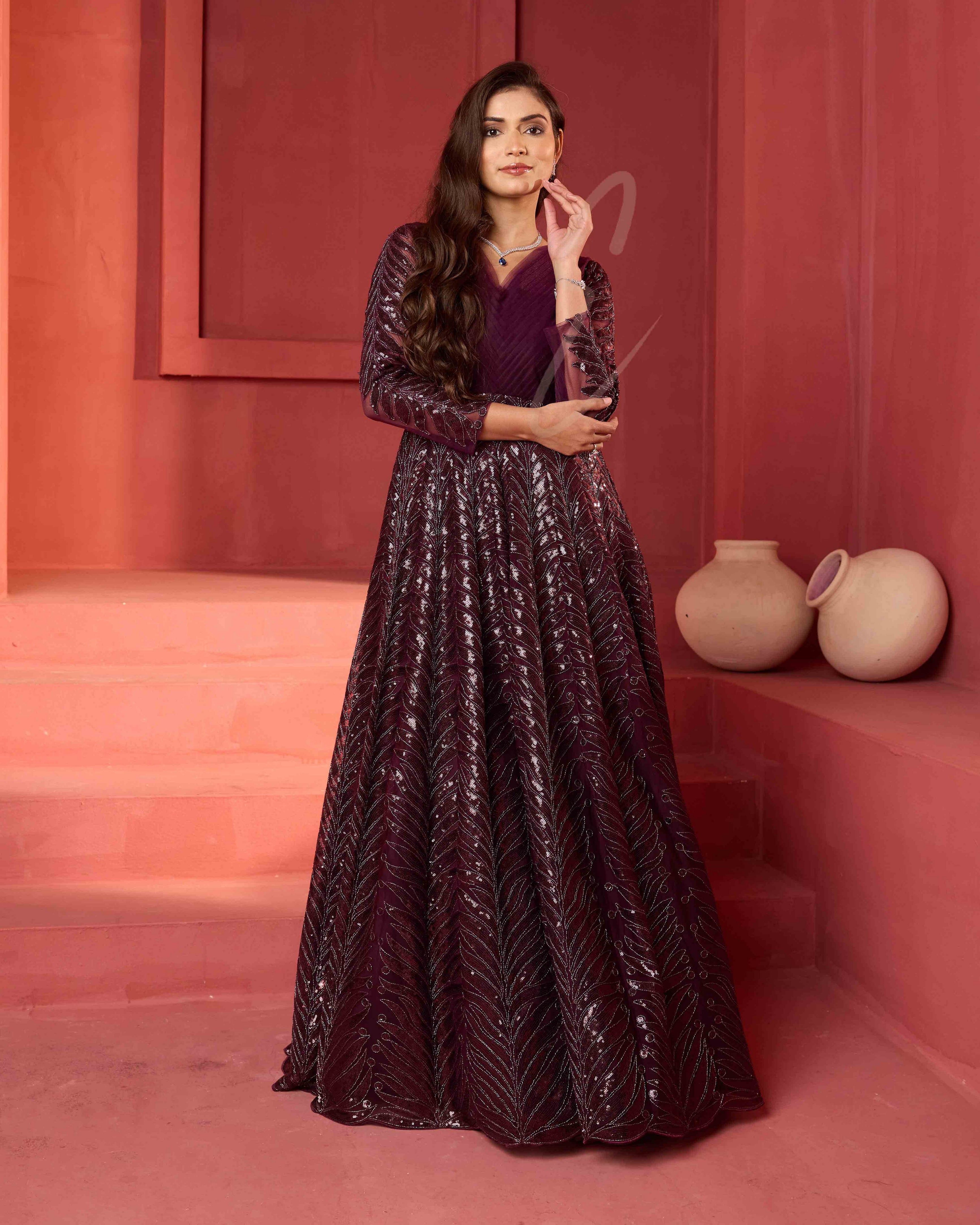 A wine-coloured premium net gown
