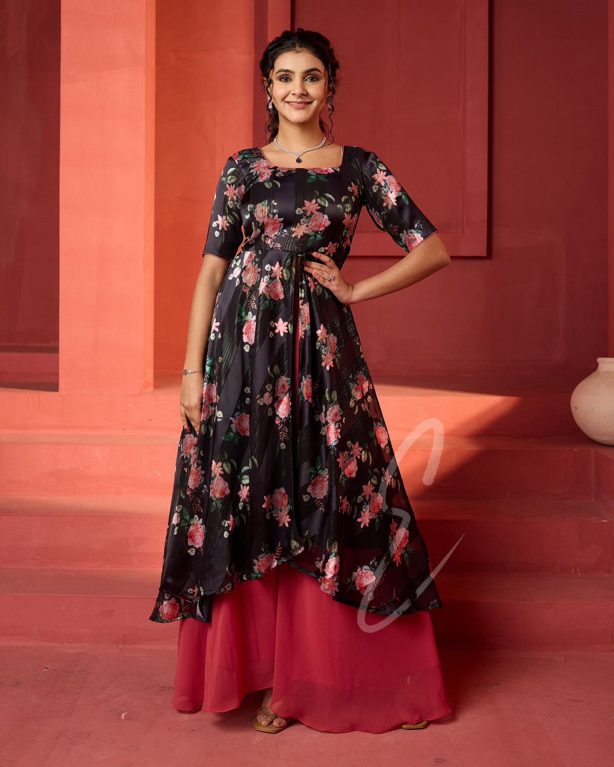 A flowy deep onion pink georgette plaza paired with a black printed georgette satin long coat