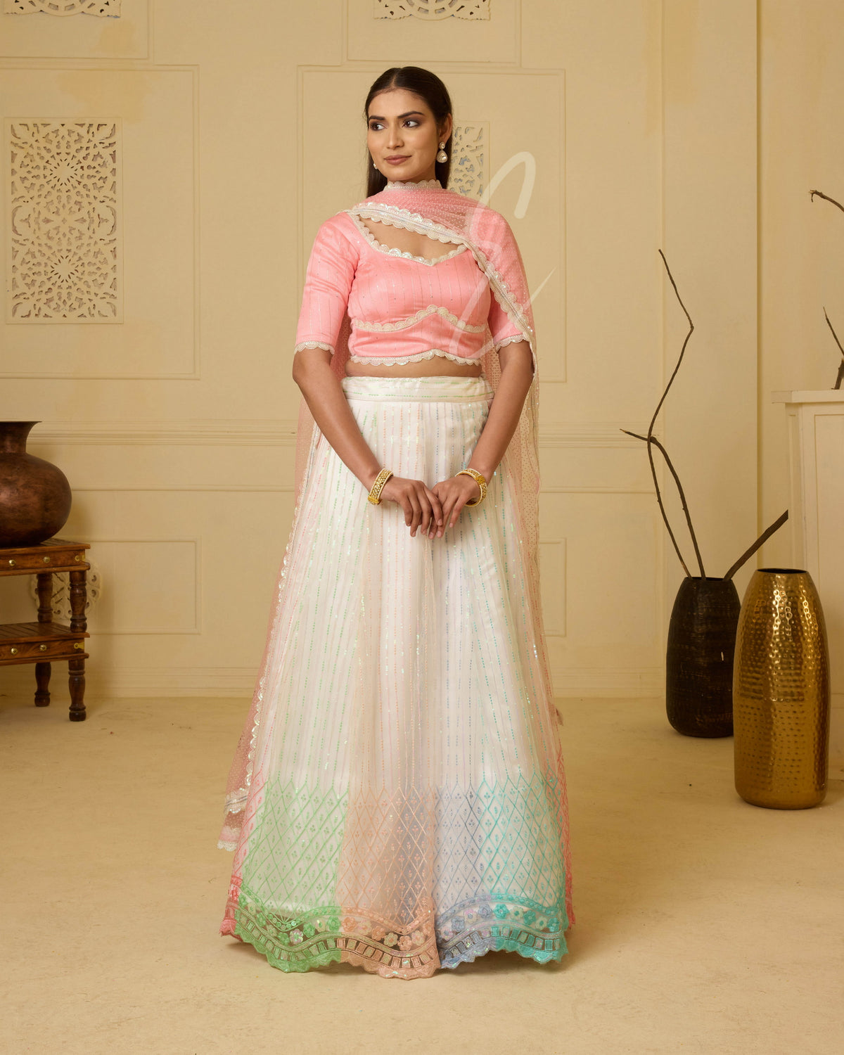 A stunning off-white and multi-color lehenga