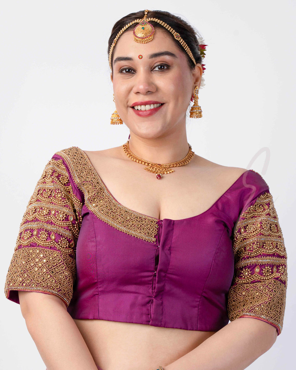 A magenta silk cotton blouse designed