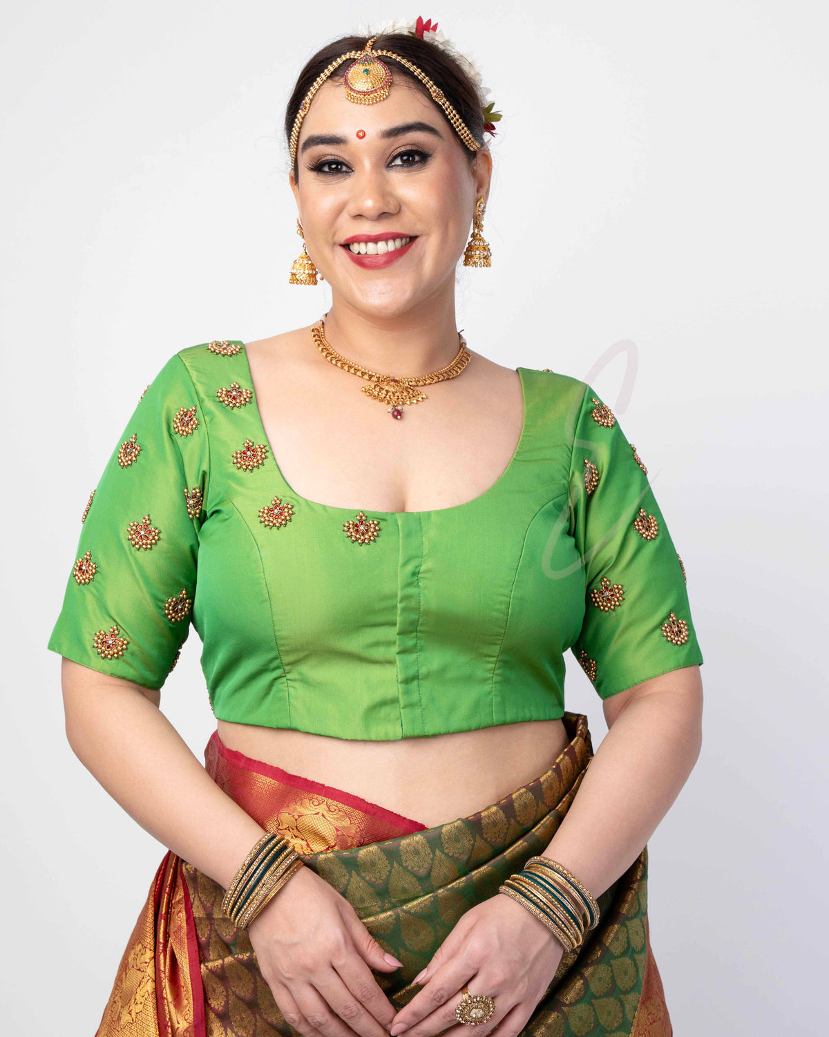 green silk cotton blouse designed in a princess-cut style