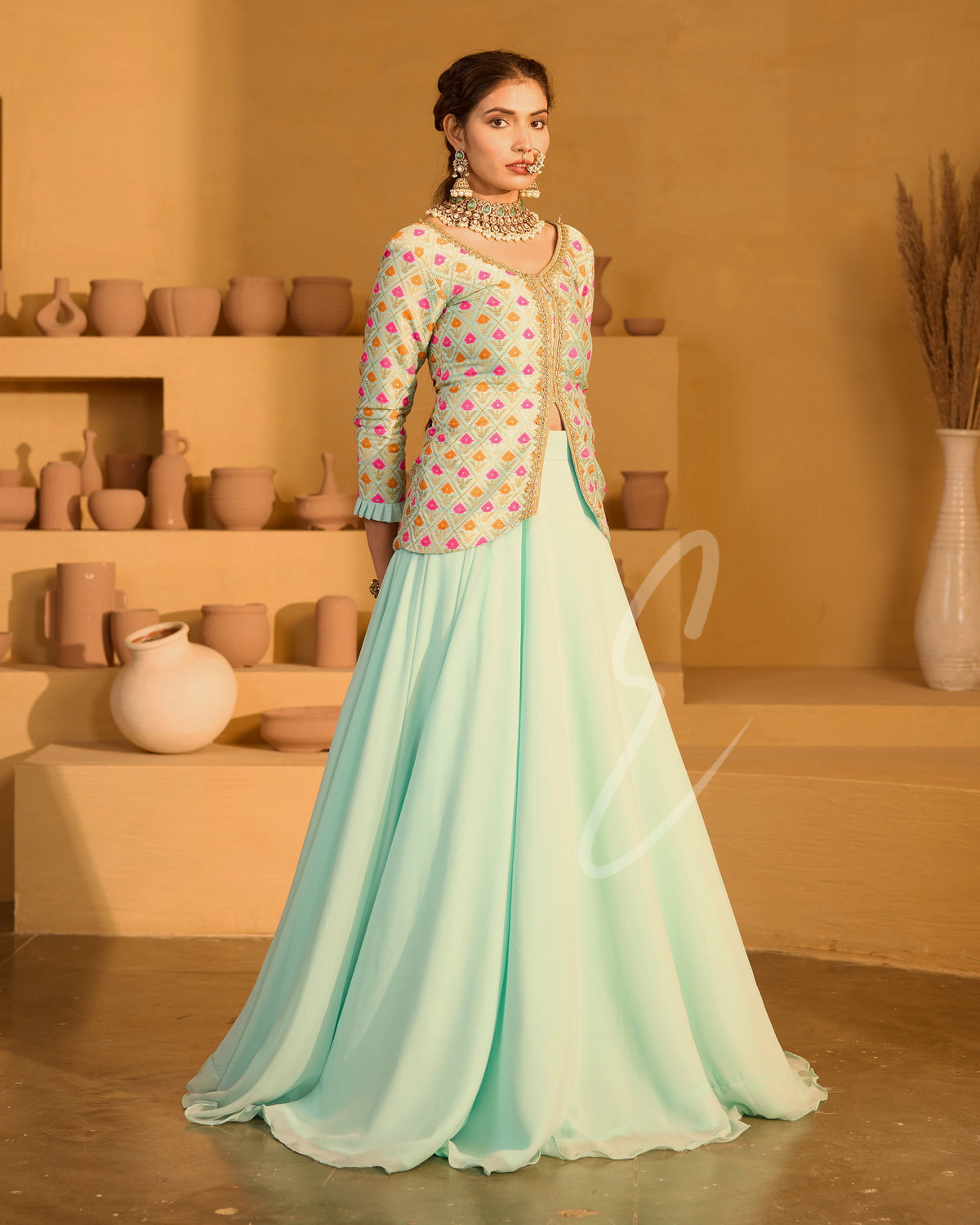 A graceful aqua blue outfit featuring a flowing georgette skirt