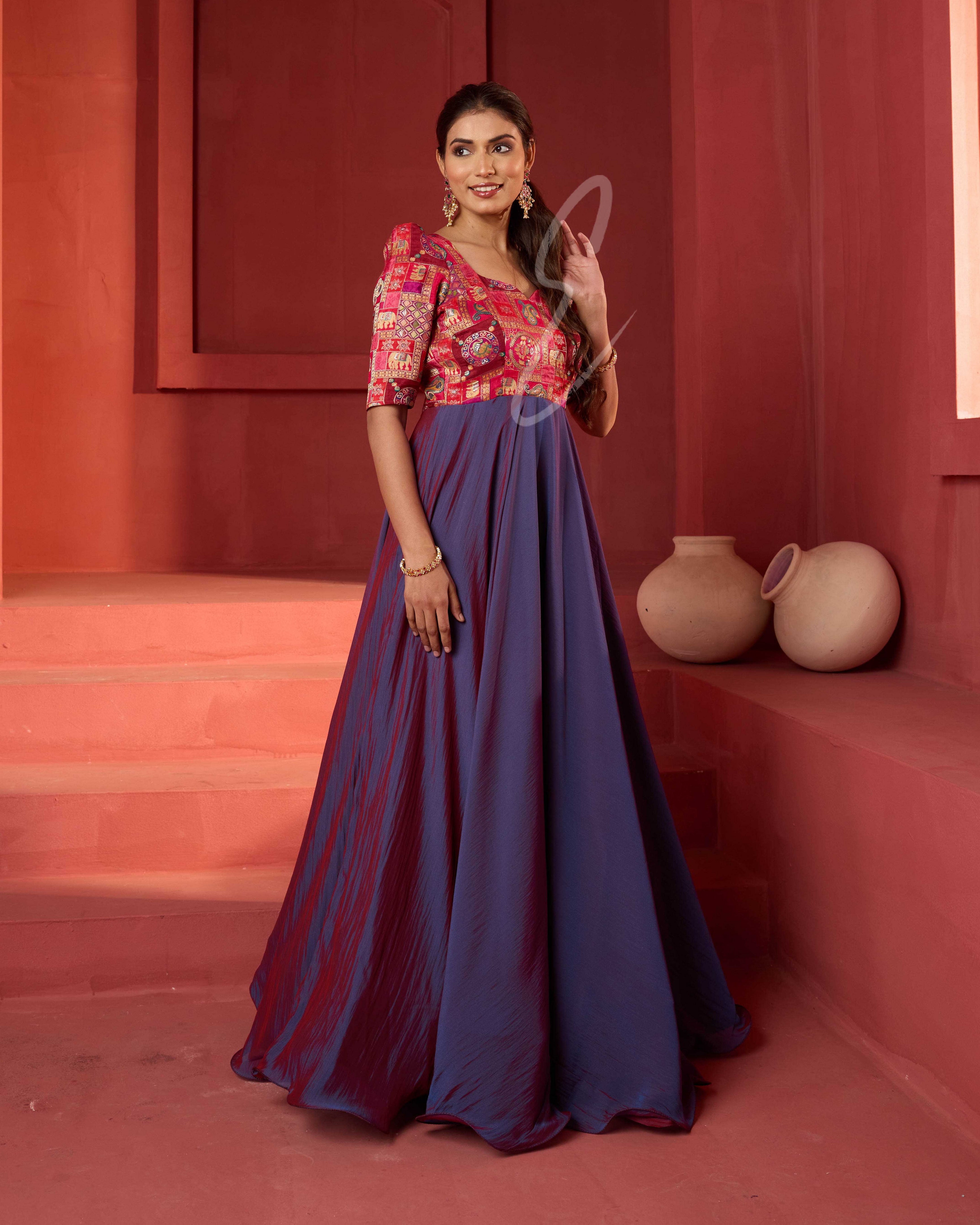 A pinkish violet flared umbrella gown