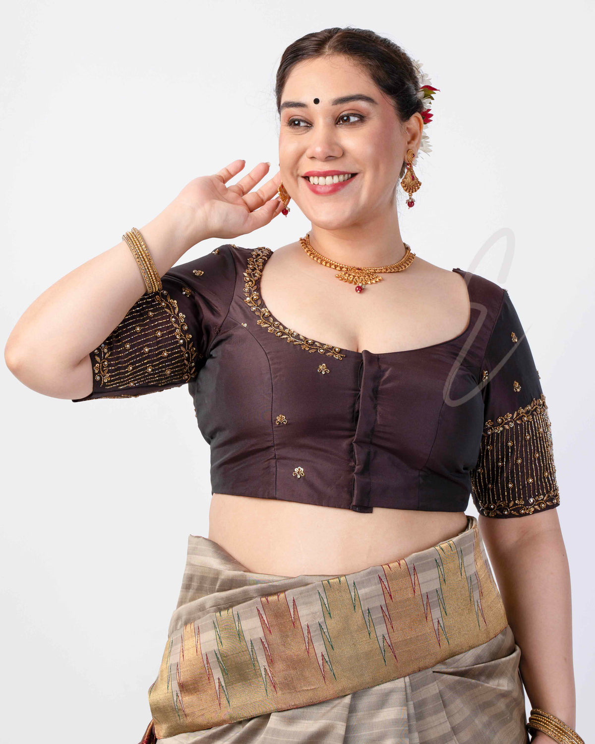 A brown silk cotton blouse designed