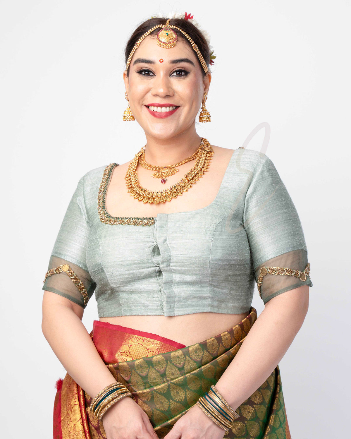 A light green raw silk blouse