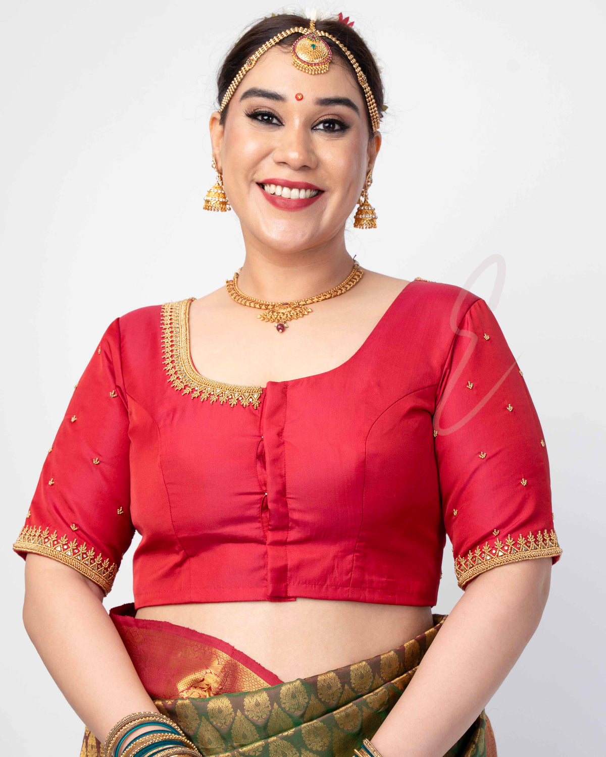 reddish pink silk cotton blouse designed in a princess-cut style