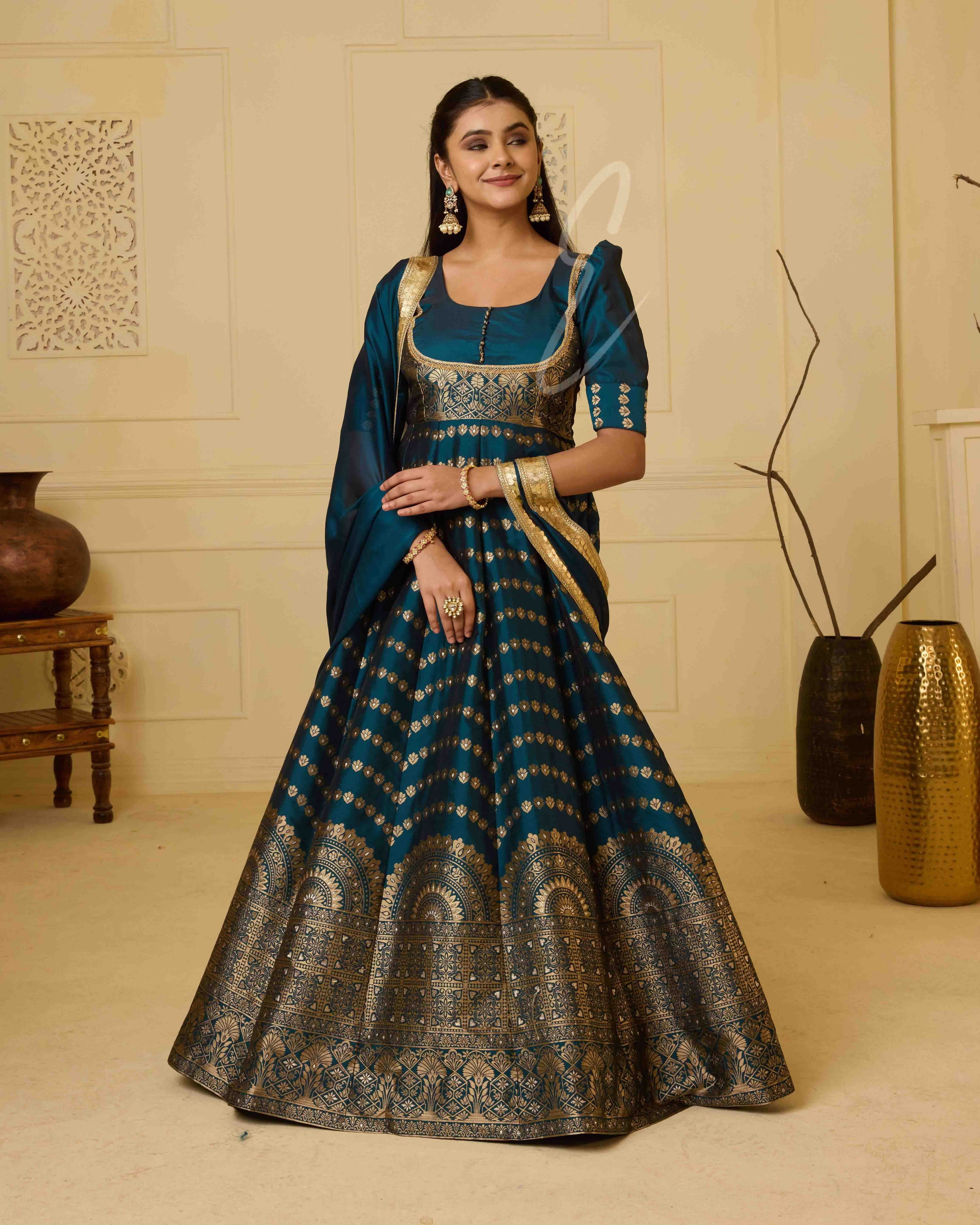A rich peacock blue Banarasi silk gown