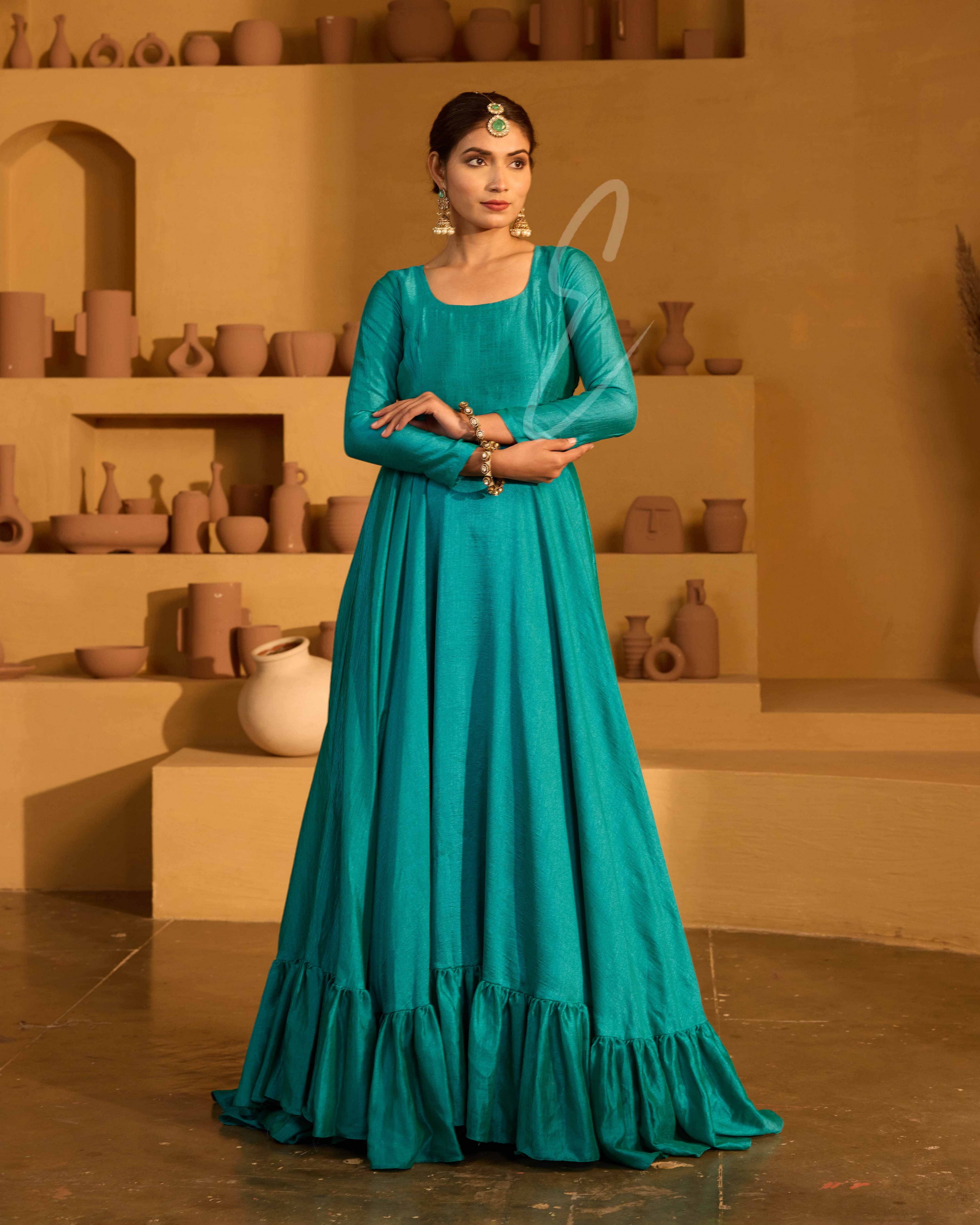 A peacock green flared gown