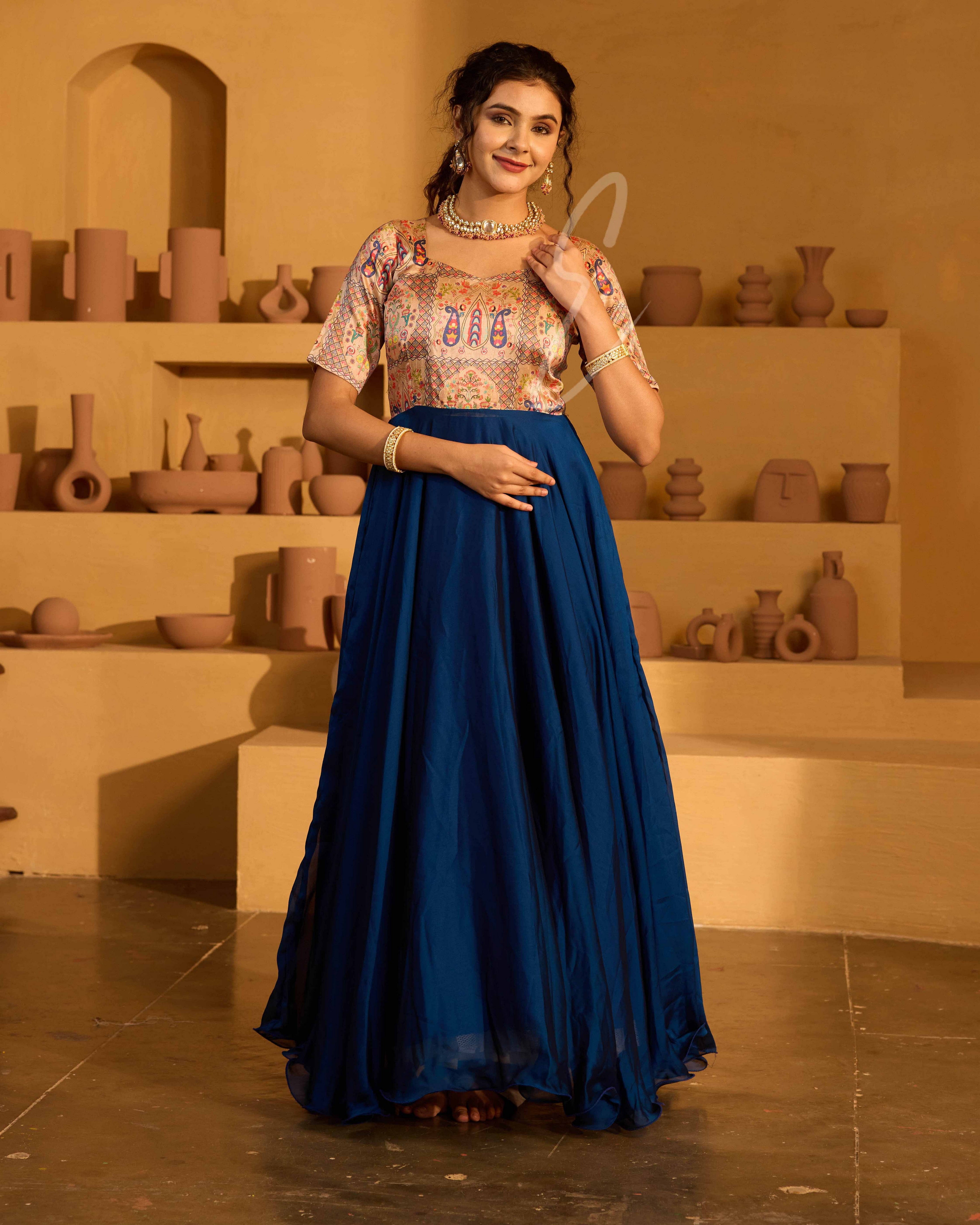 A peacock blue georgette silk gown