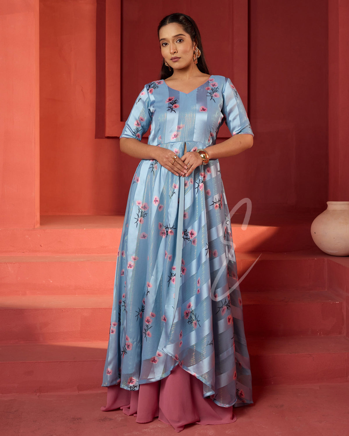 A powder blue printed long coat-style top paired with a flowy mild pink palazzo