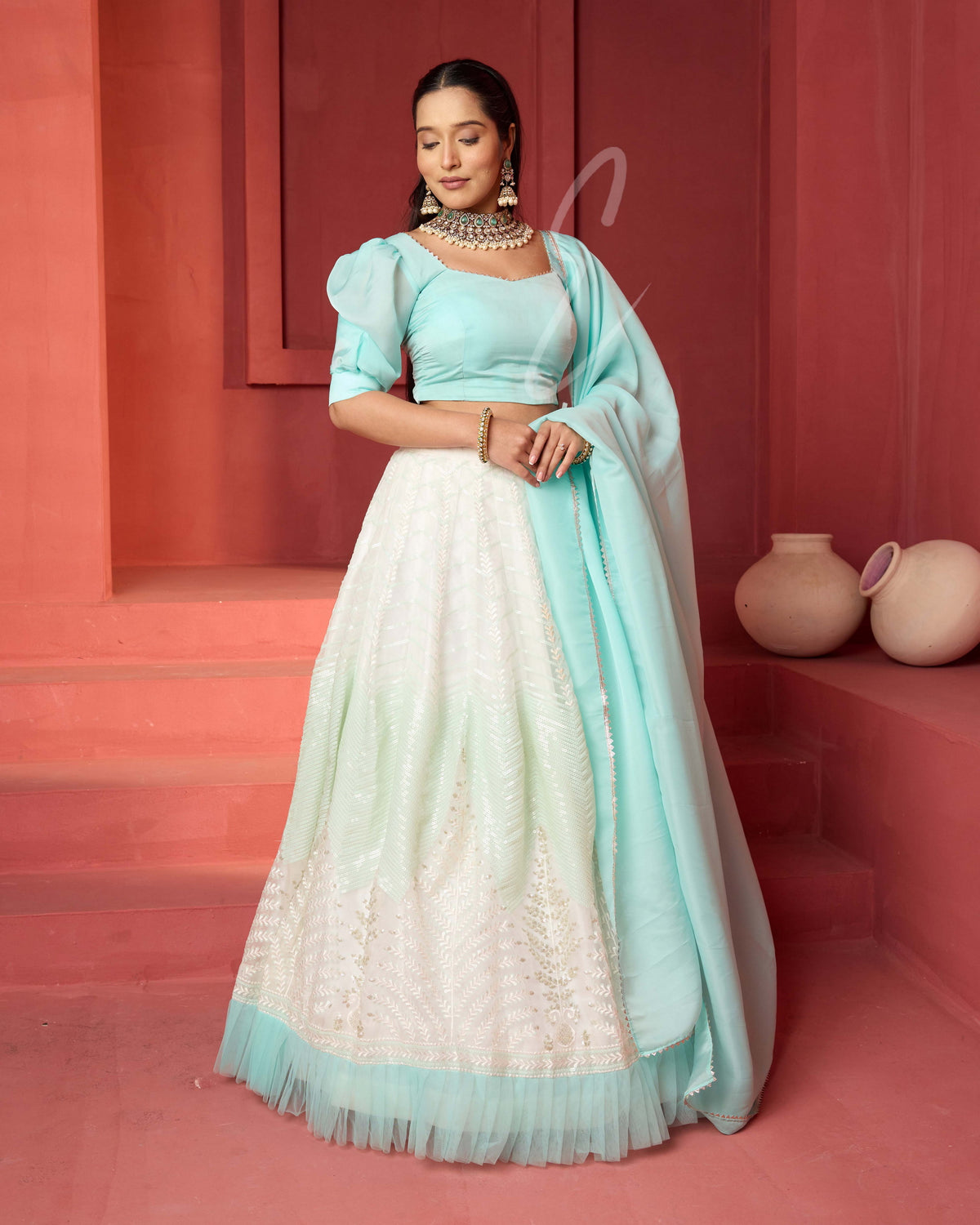 This off-white and turquoise lehenga