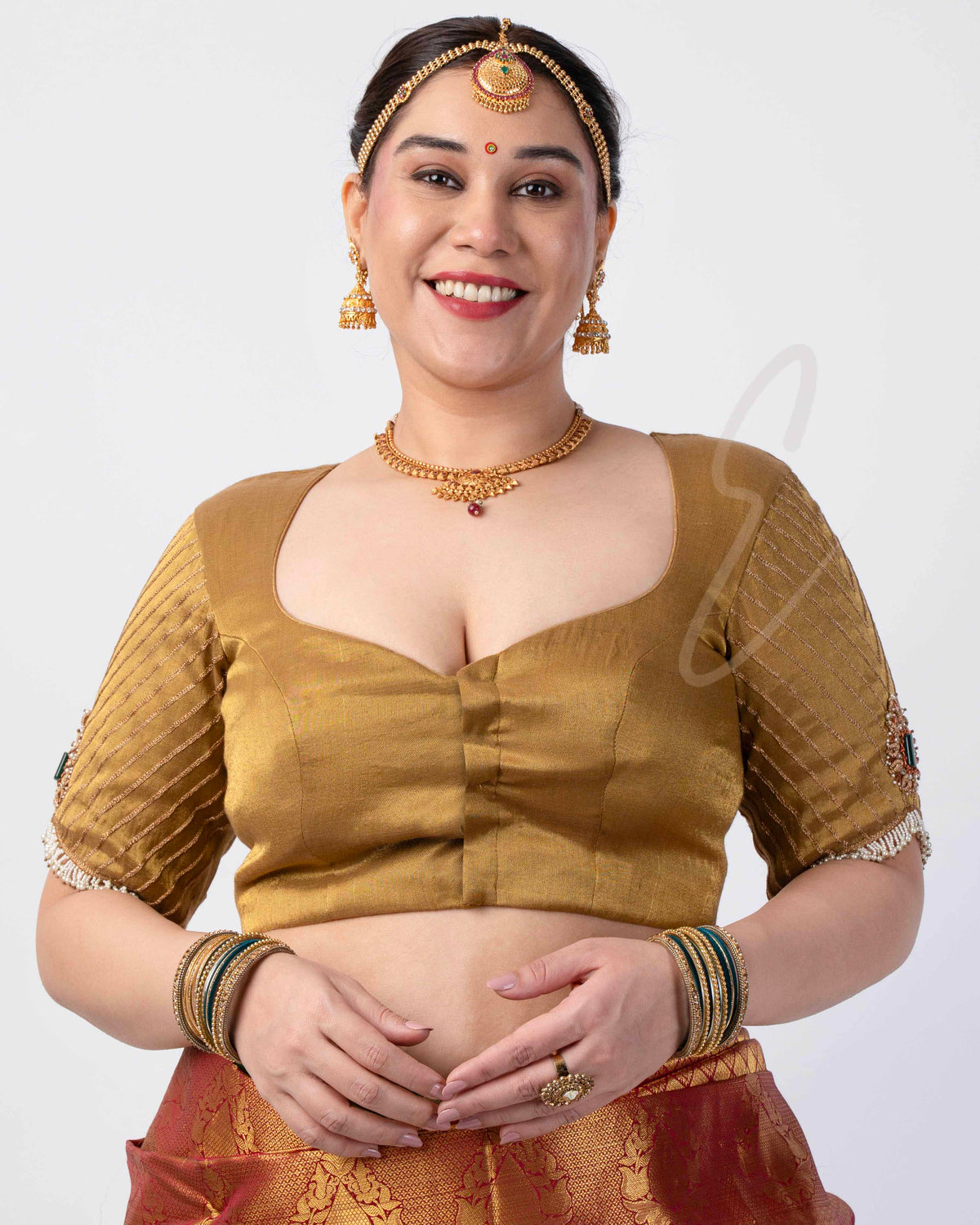 A gold tissue silk blouse