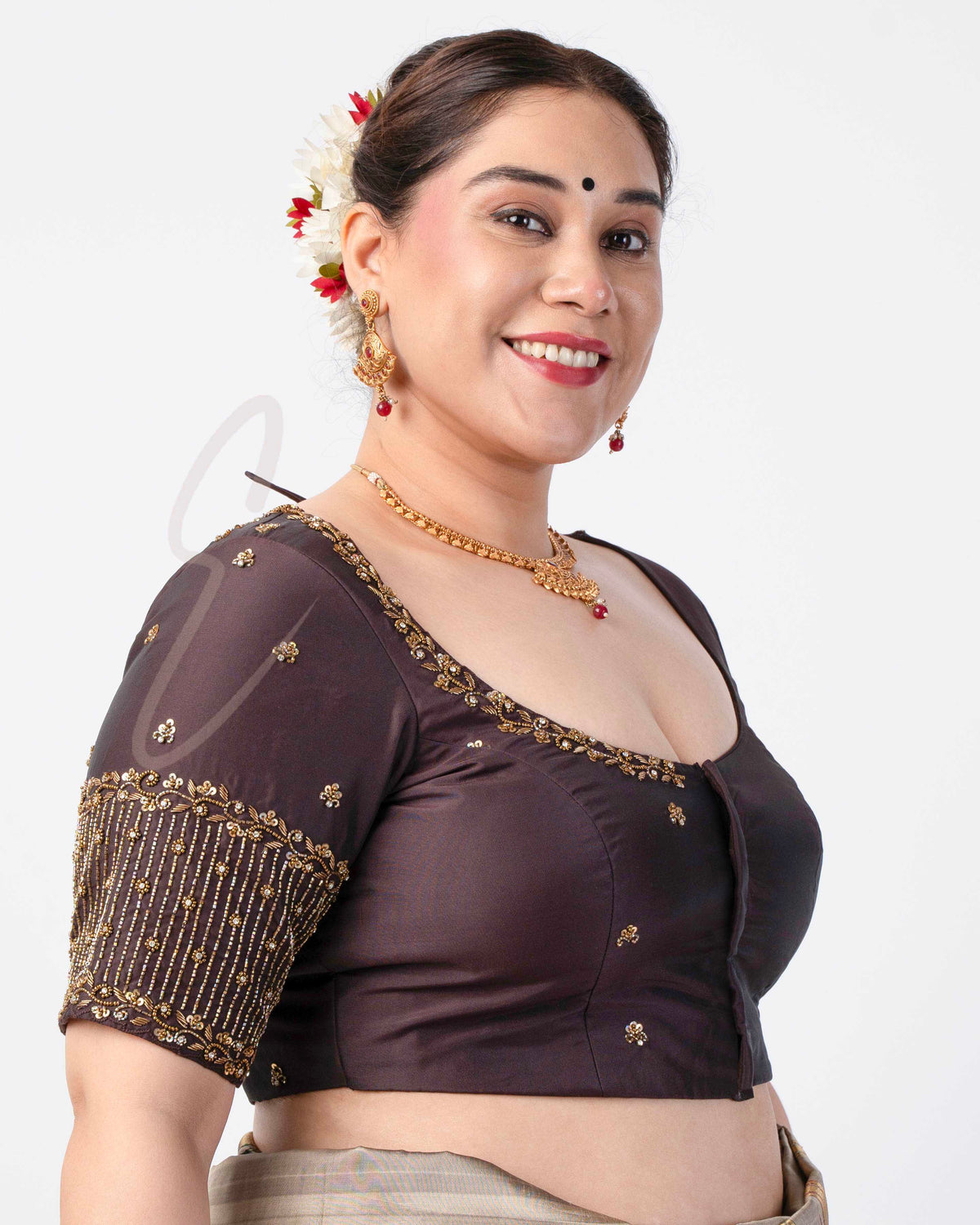A brown silk cotton blouse designed