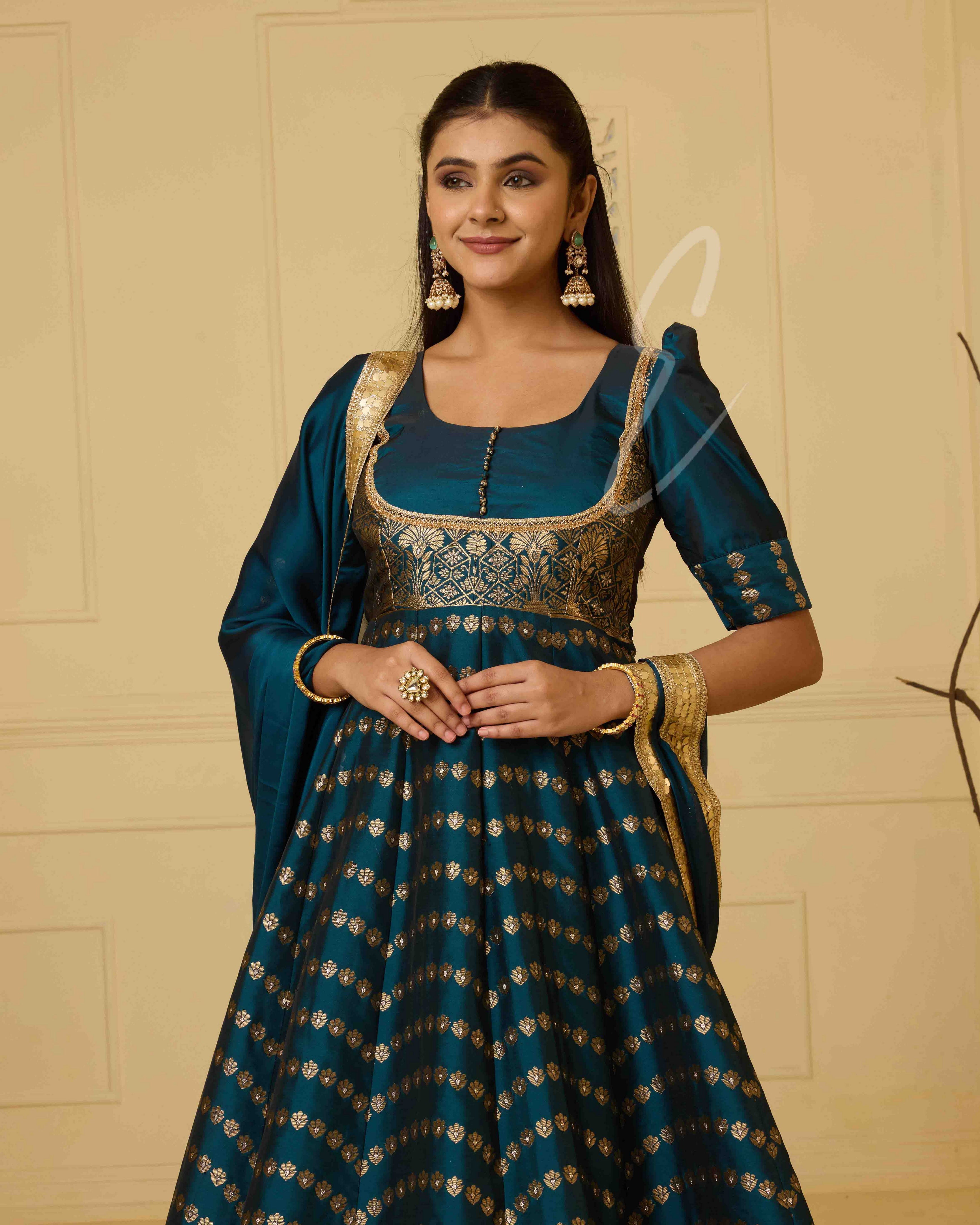 A rich peacock blue Banarasi silk gown