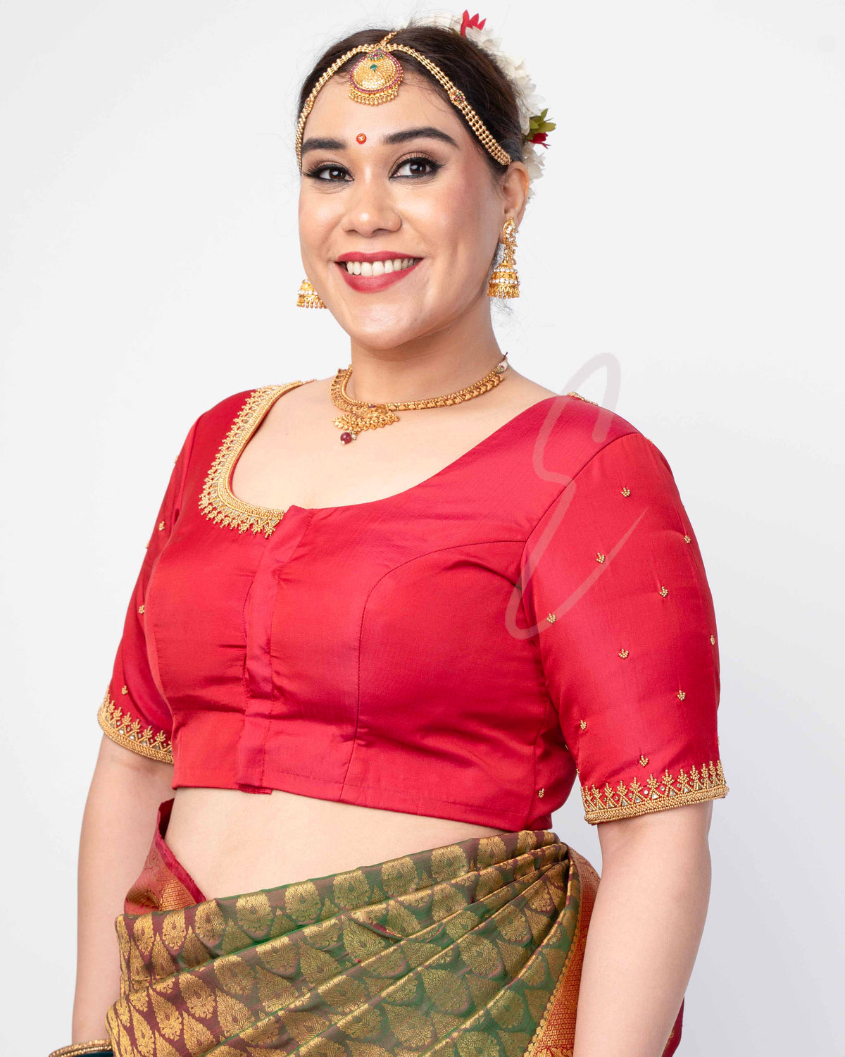 reddish pink silk cotton blouse designed in a princess-cut style