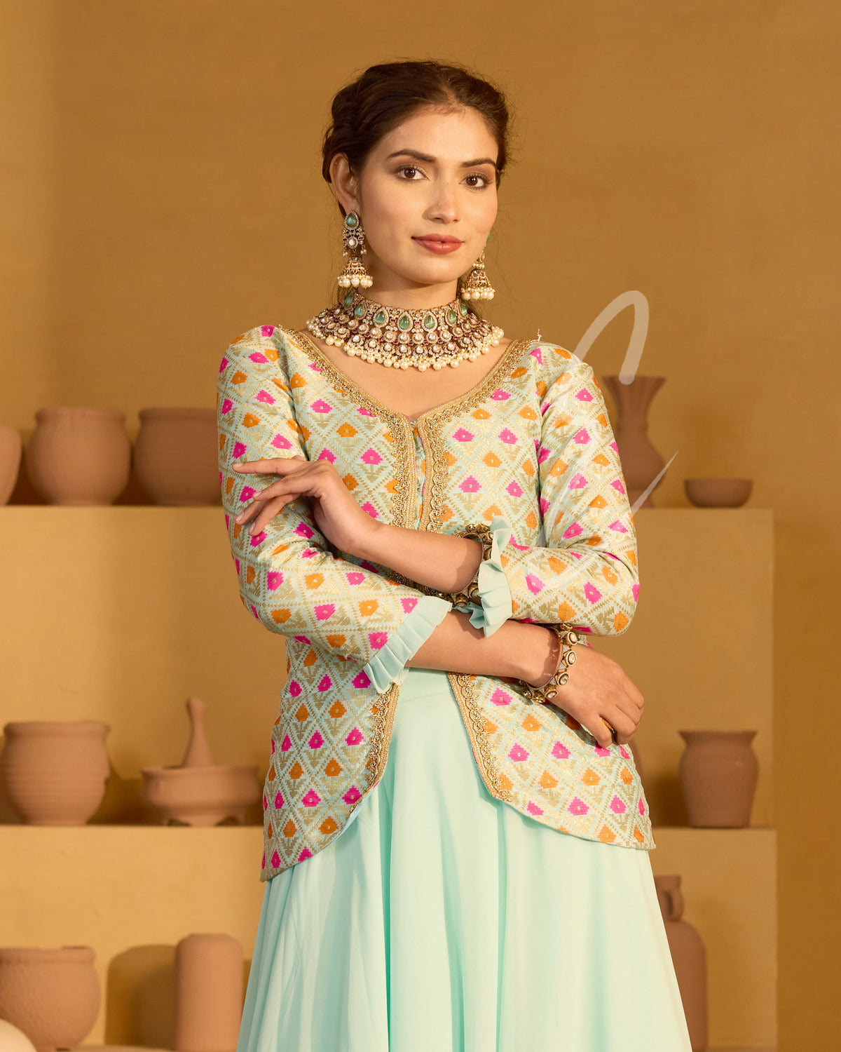 A graceful aqua blue outfit featuring a flowing georgette skirt