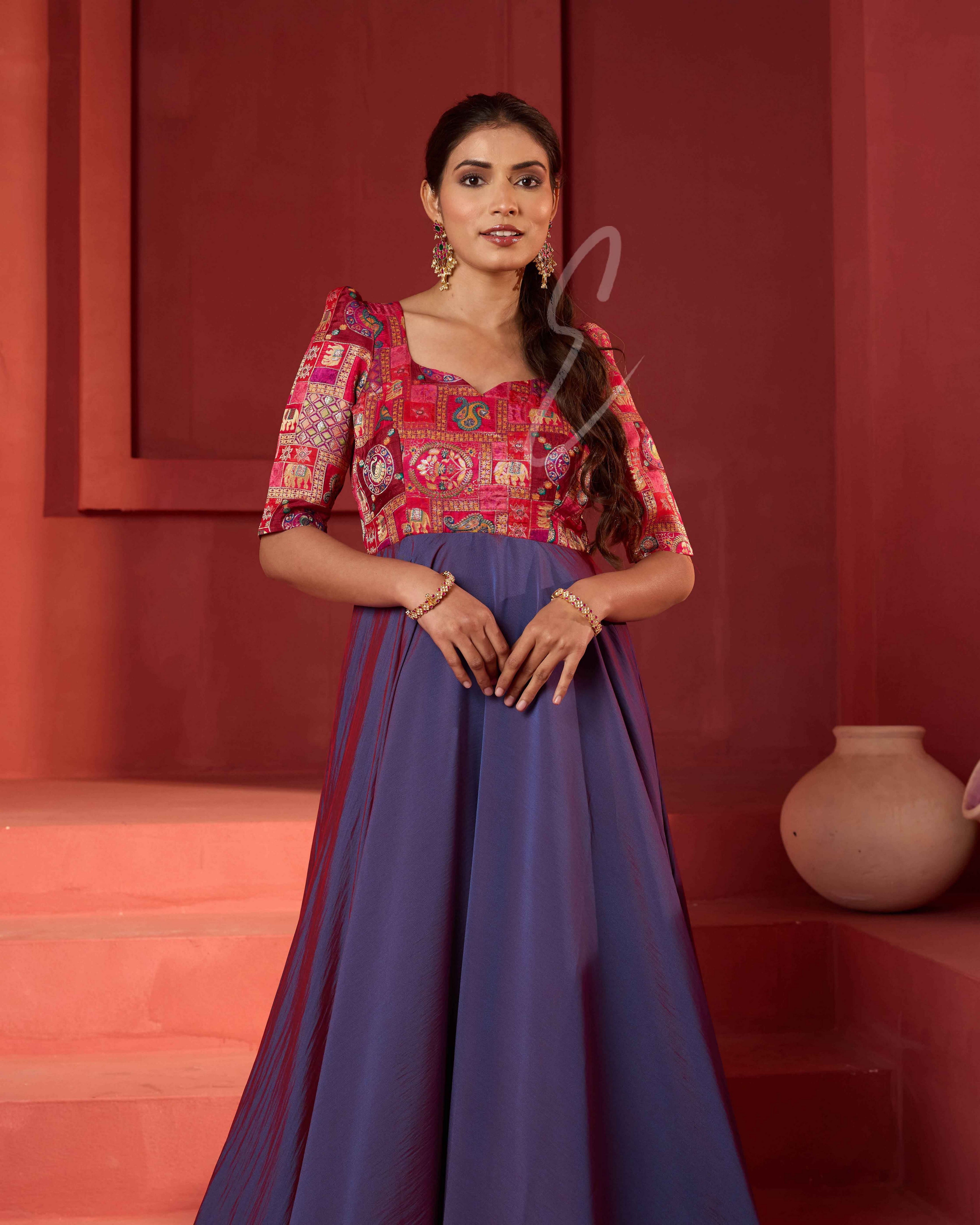 A pinkish violet flared umbrella gown