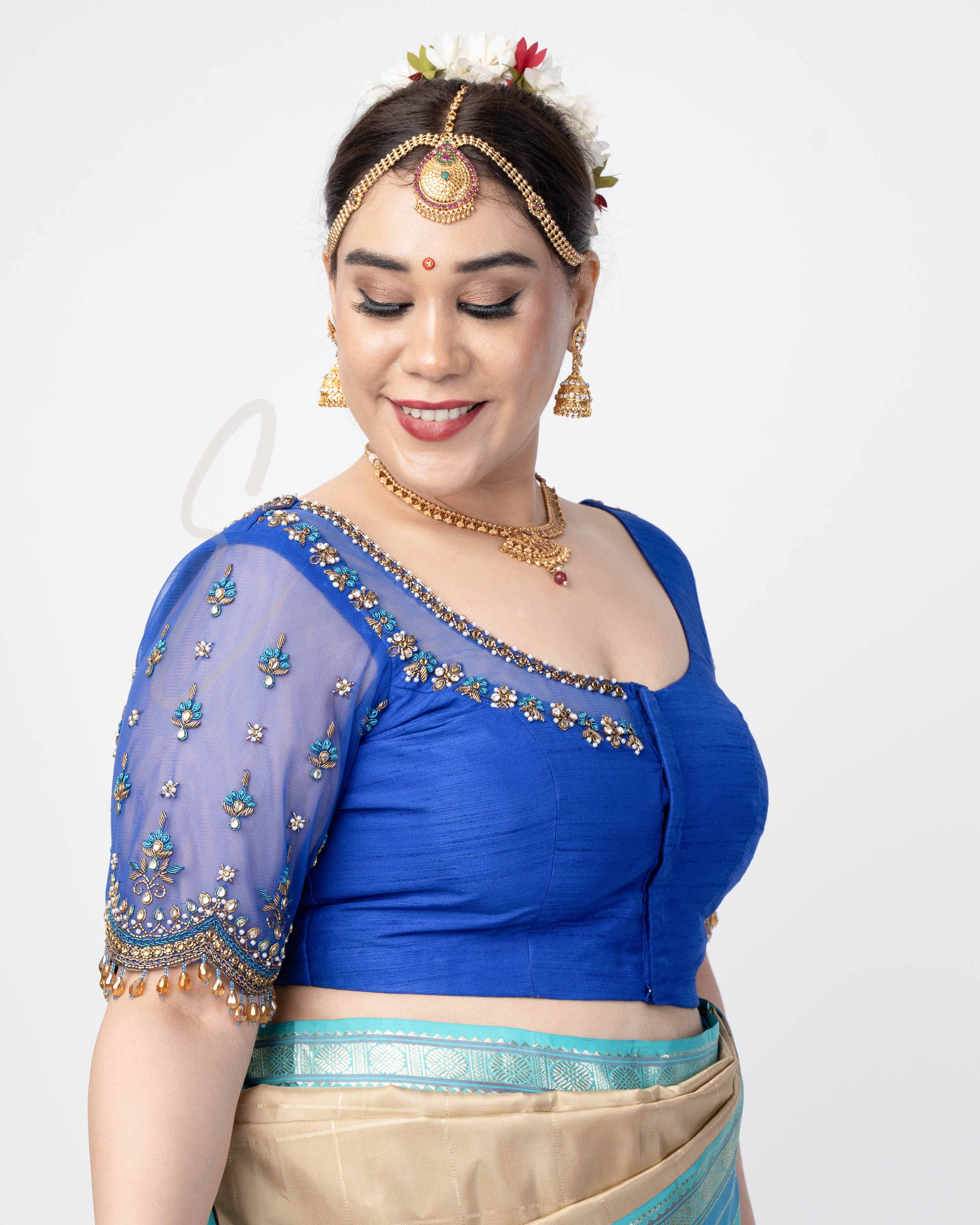 A blue raw silk with net blouse designed