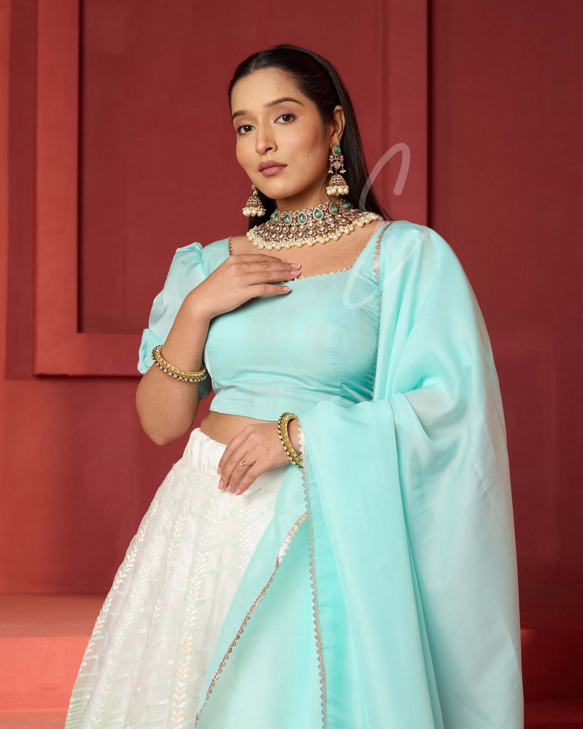 This off-white and turquoise lehenga