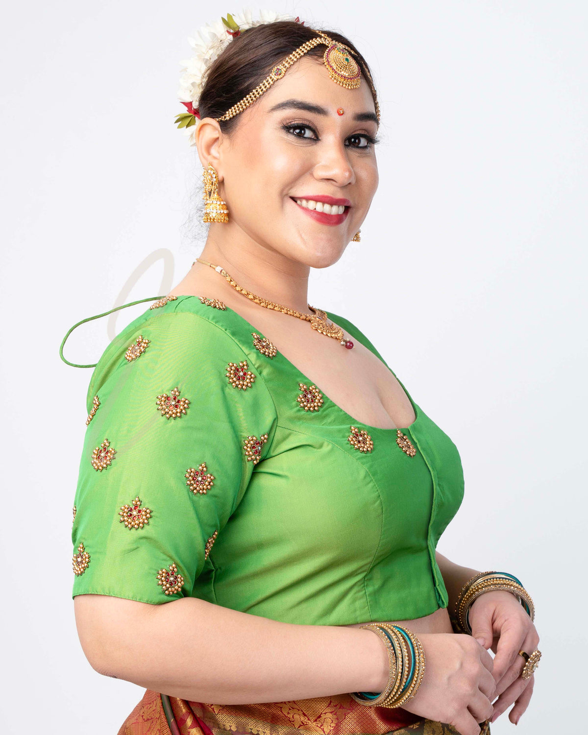 green silk cotton blouse designed in a princess-cut style