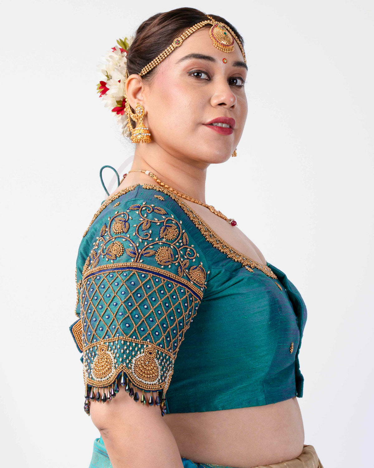 A peacock green raw silk blouse