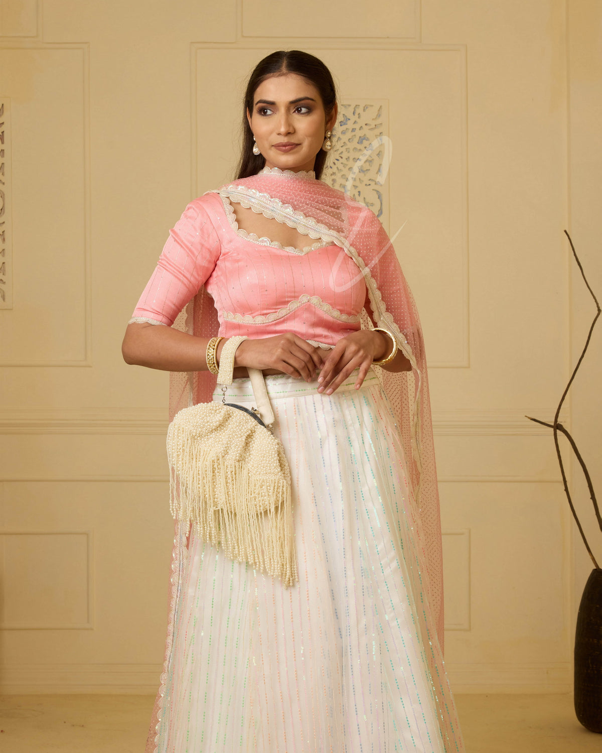 A stunning off-white and multi-color lehenga