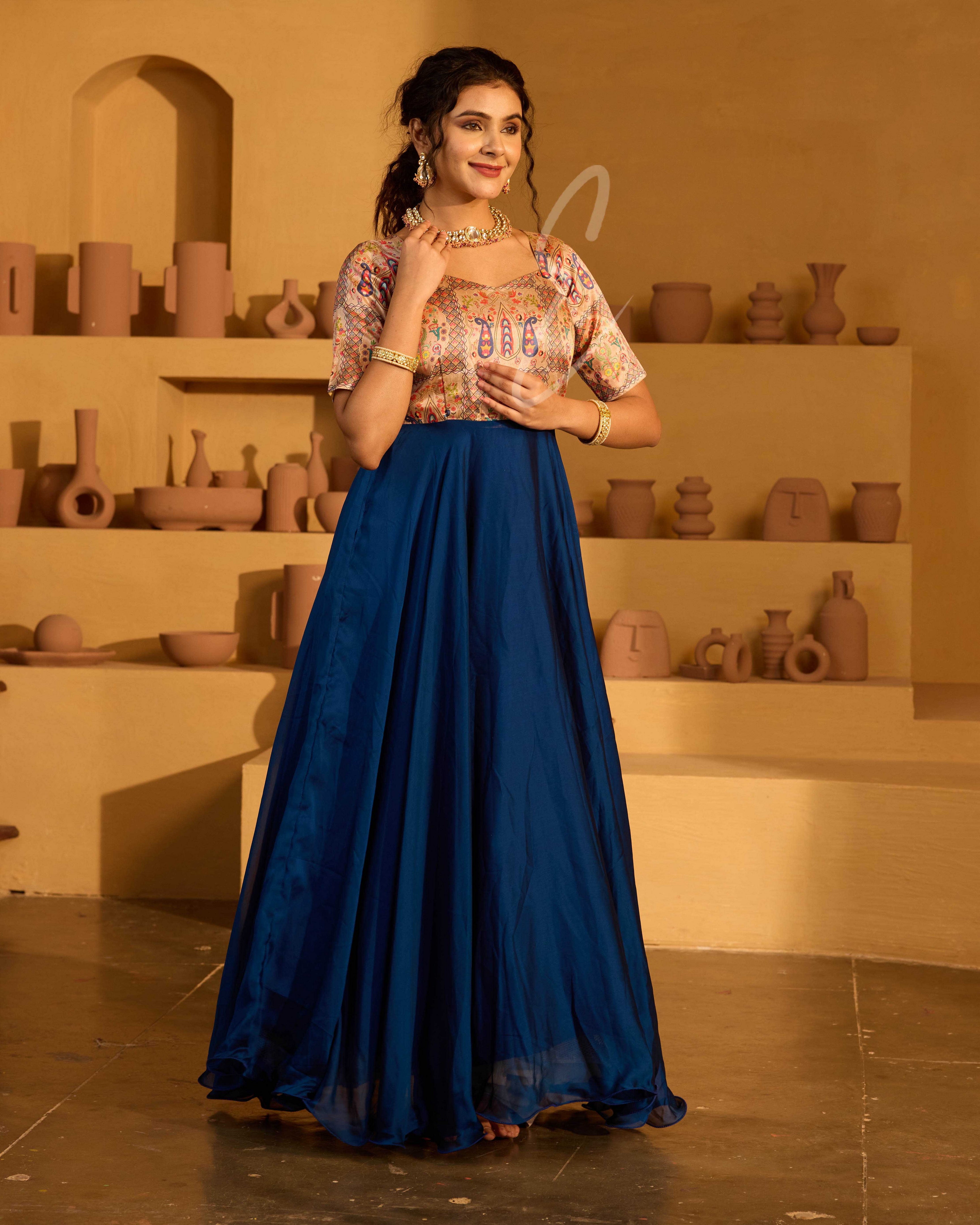 A peacock blue georgette silk gown
