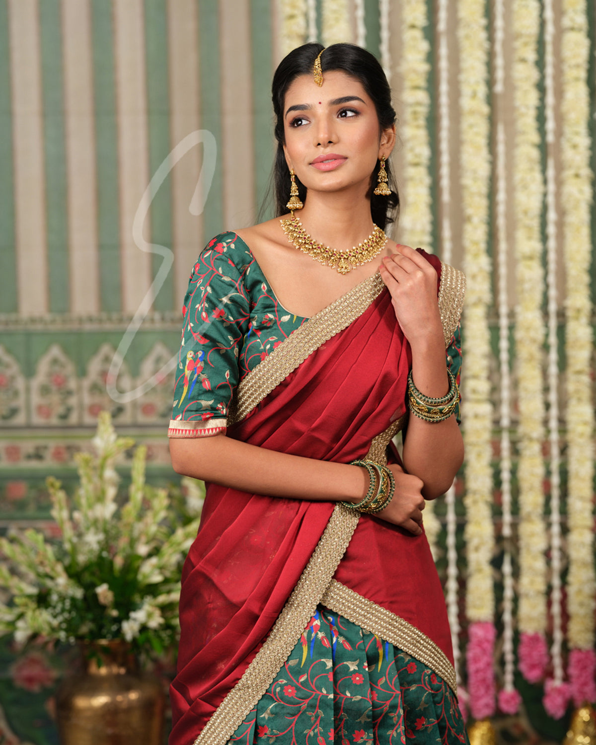 Rich dark green Banarasi silk half saree with intricate maroon jari
