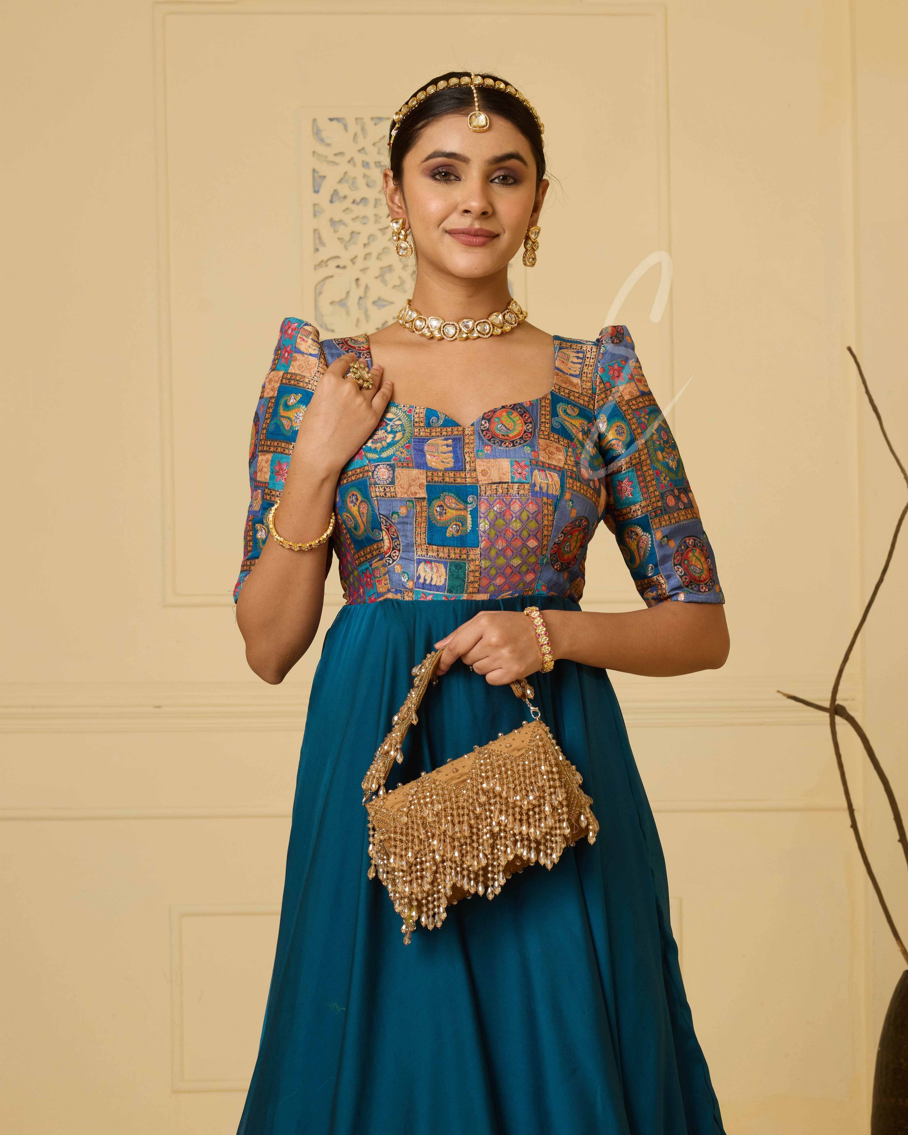 A peacock blue georgette silk gown