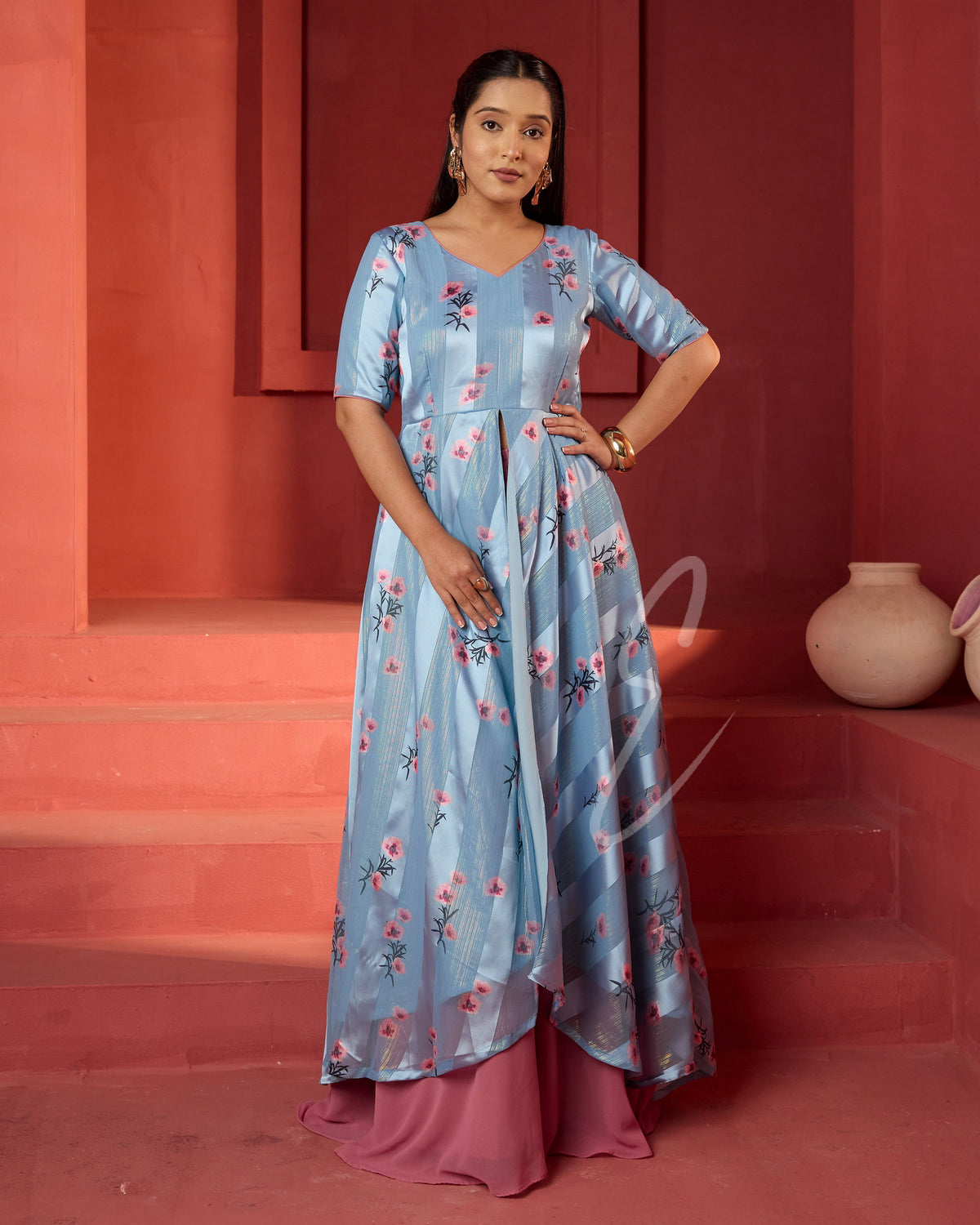 A powder blue printed long coat-style top paired with a flowy mild pink palazzo