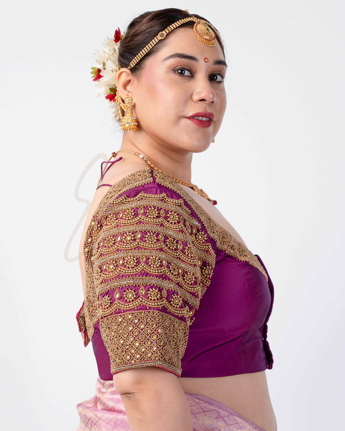 A magenta silk cotton blouse designed