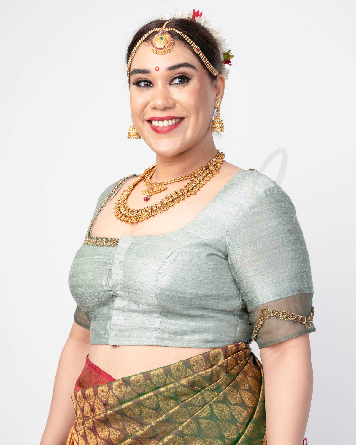 A light green raw silk blouse