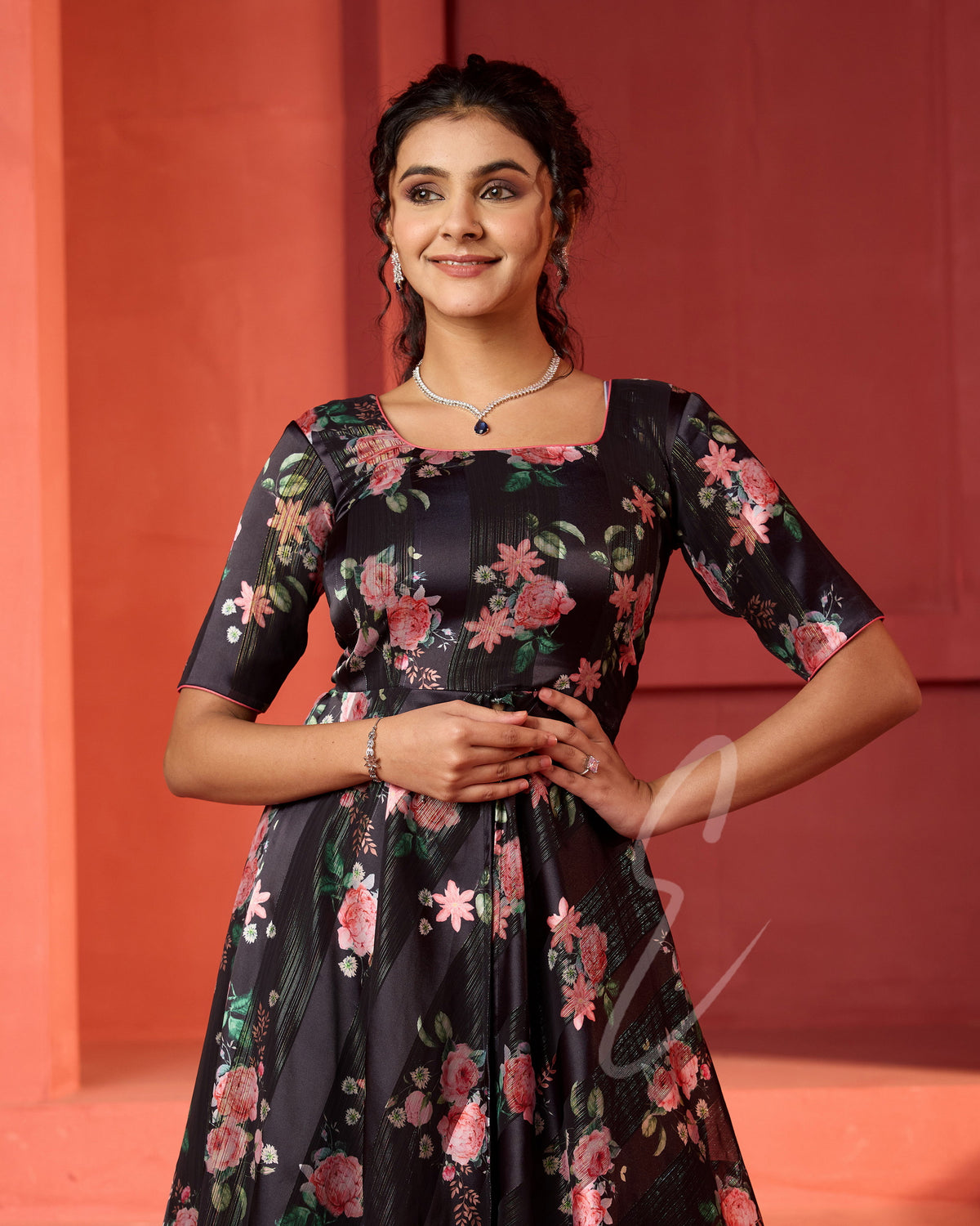 A flowy deep onion pink georgette plaza paired with a black printed georgette satin long coat