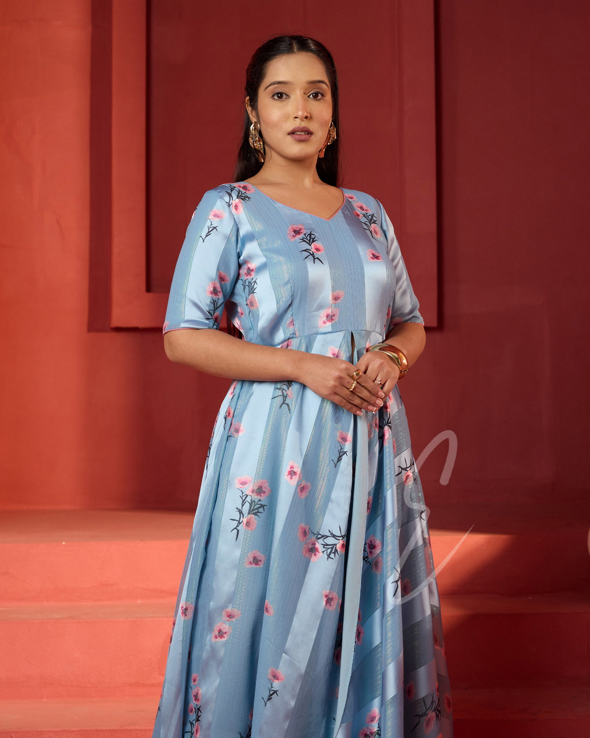 A powder blue printed long coat-style top paired with a flowy mild pink palazzo