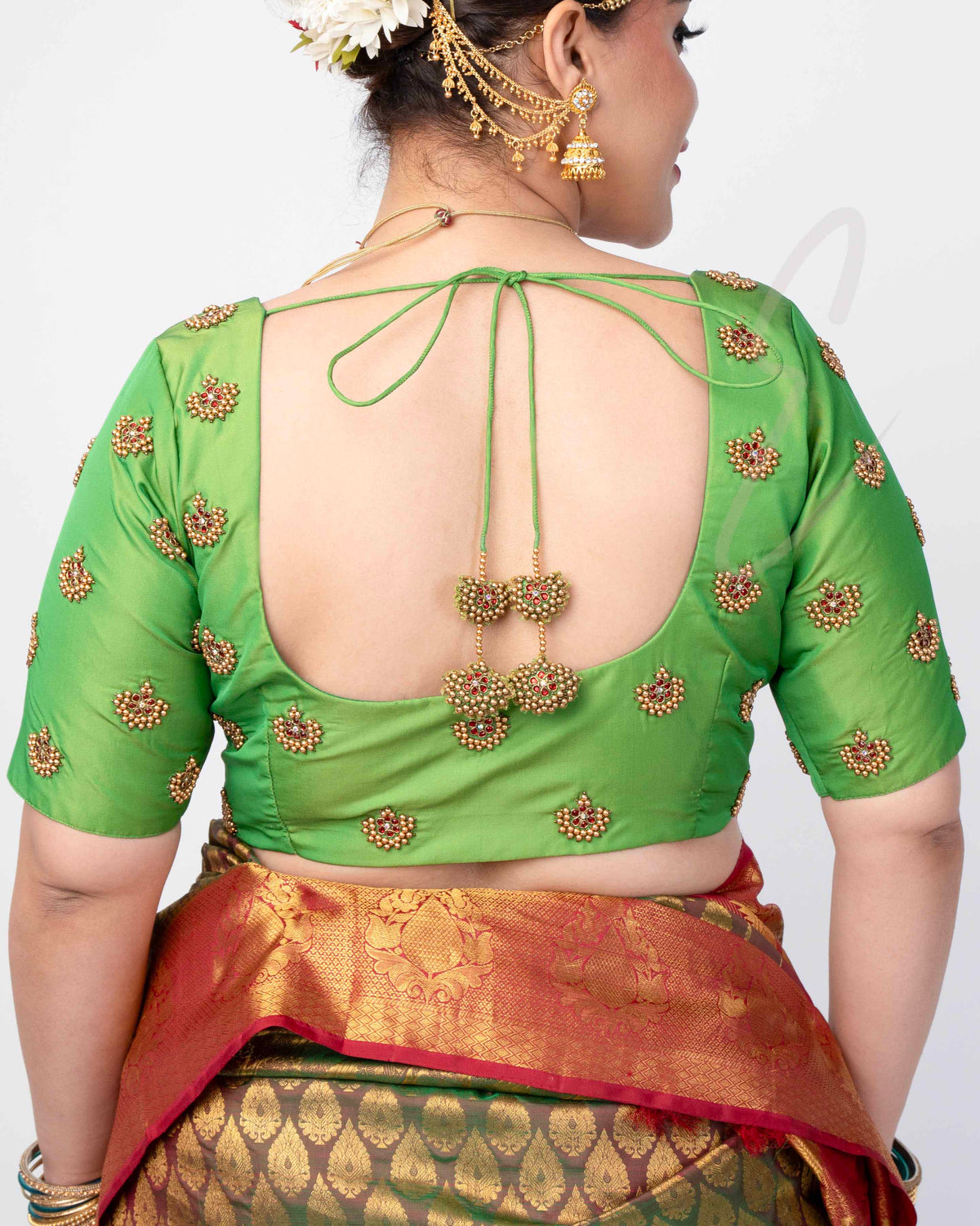 green silk cotton blouse designed in a princess-cut style