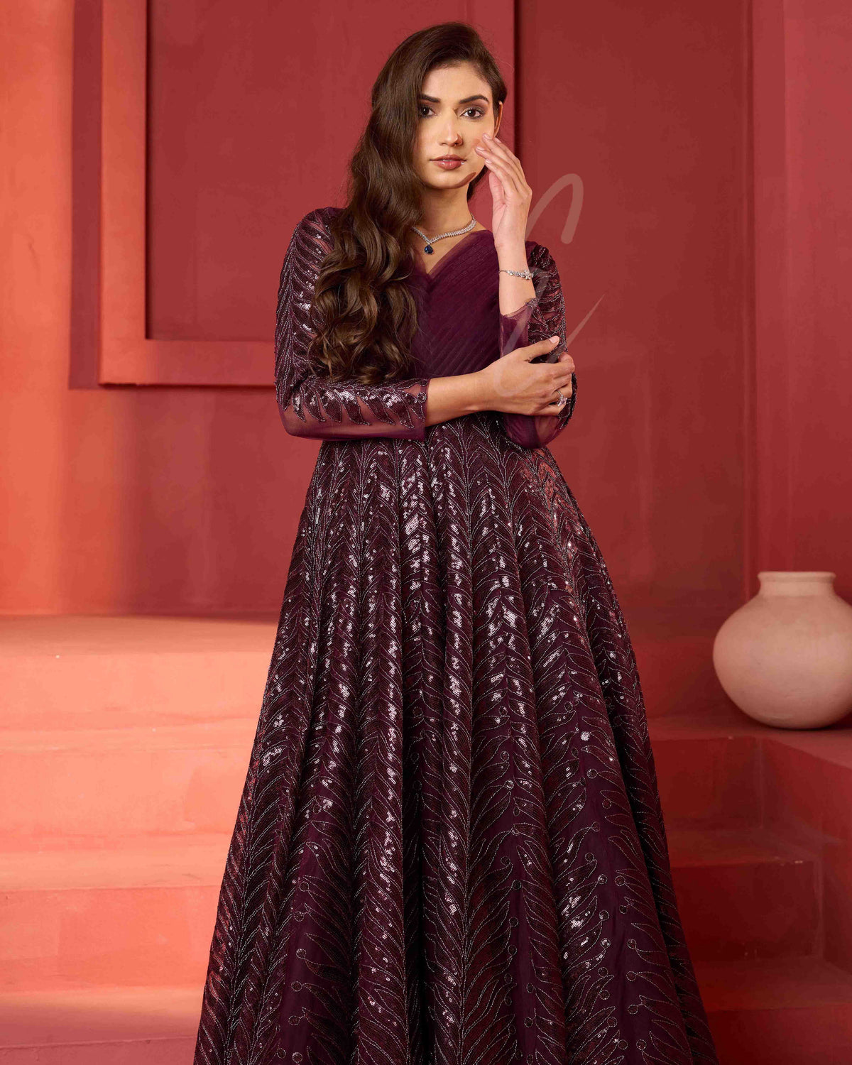 A wine-coloured premium net gown