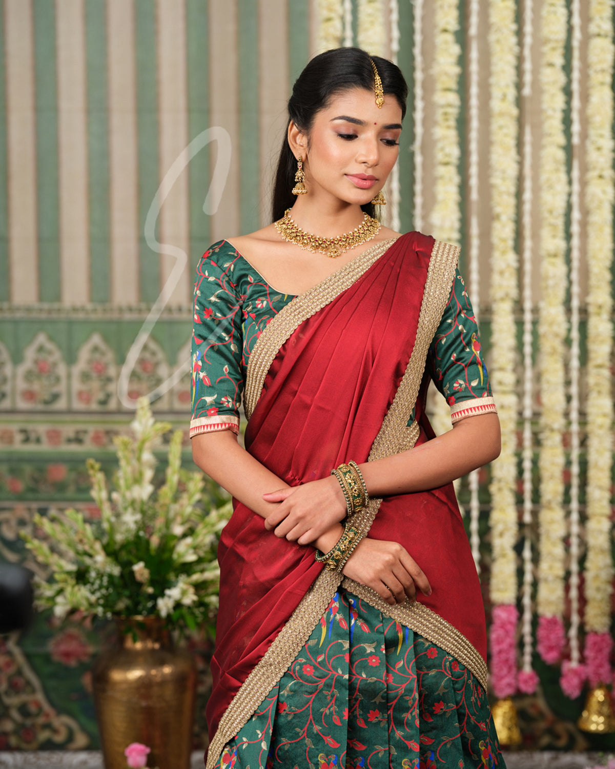 Rich dark green Banarasi silk half saree with intricate maroon jari