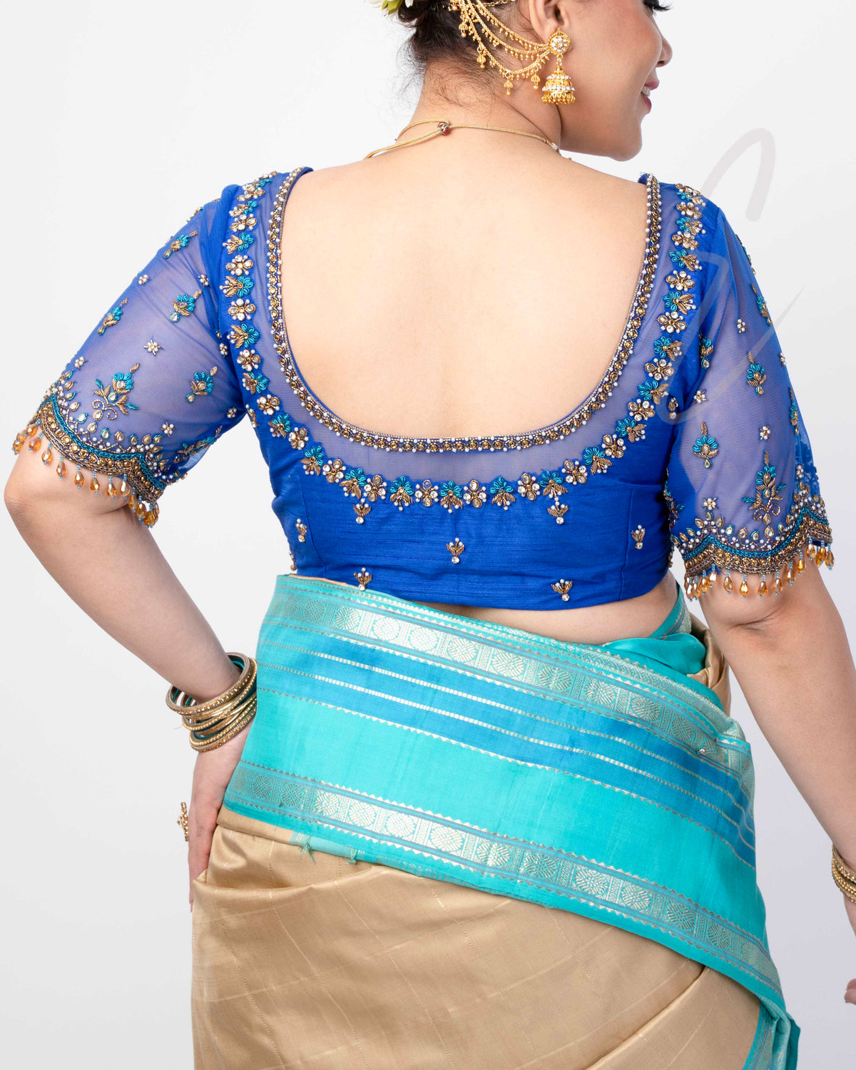 A blue raw silk with net blouse designed