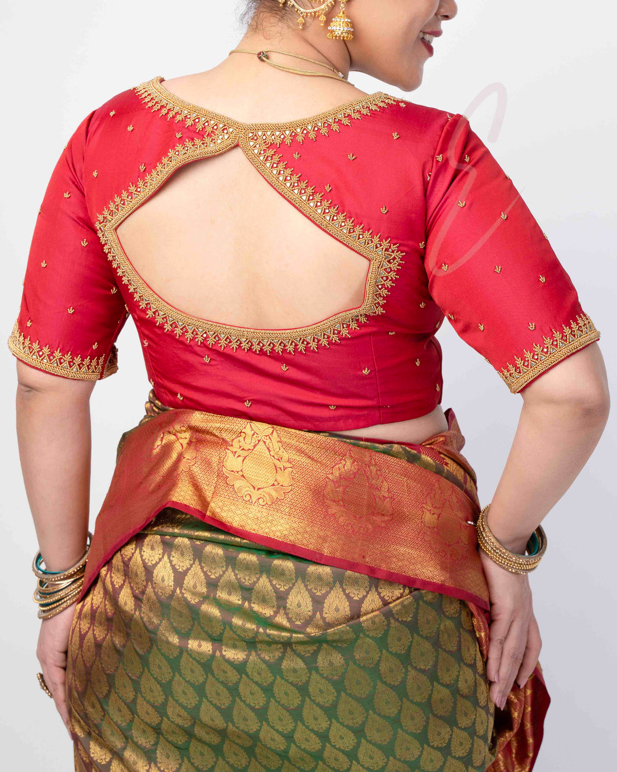 reddish pink silk cotton blouse designed in a princess-cut style