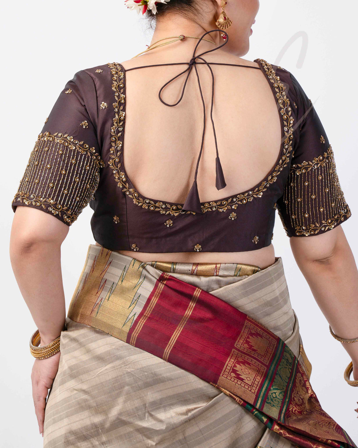 A brown silk cotton blouse designed