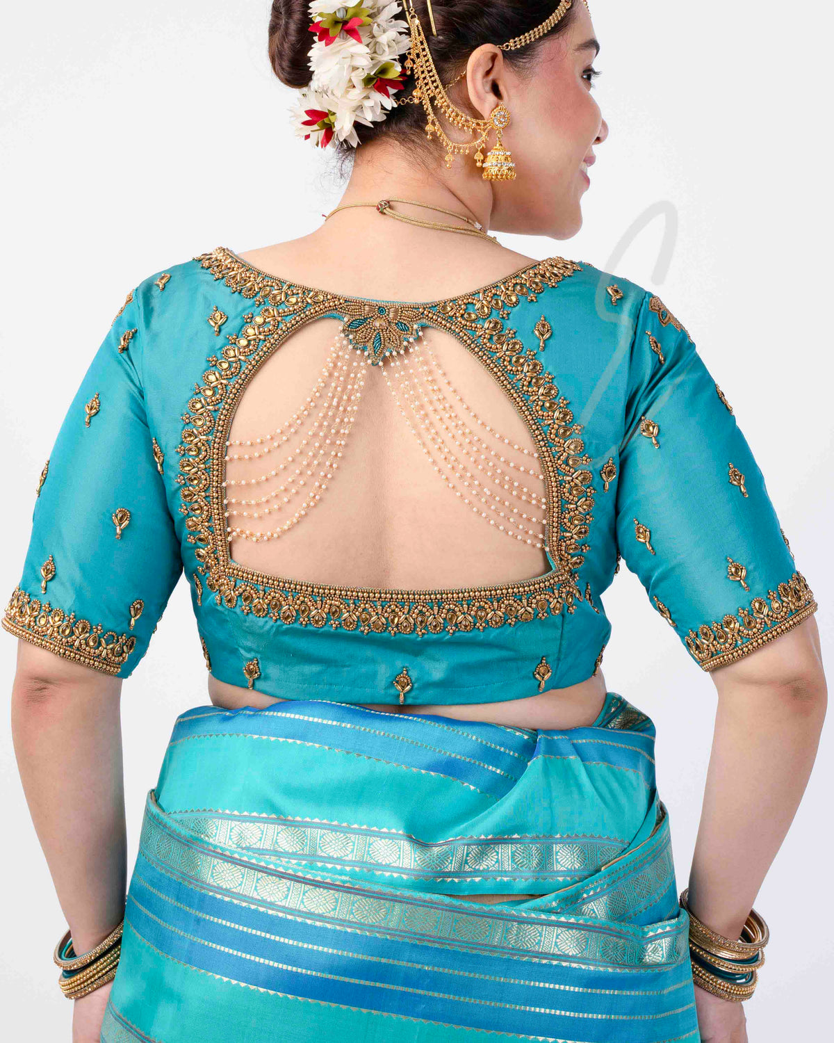 A Rama blue silk cotton blouse designed