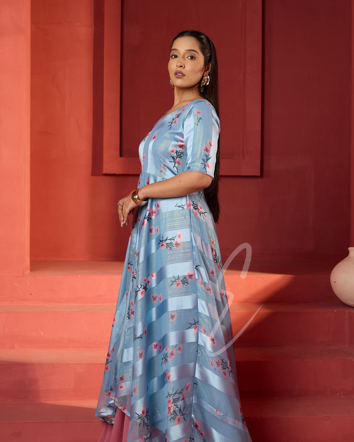 A powder blue printed long coat-style top paired with a flowy mild pink palazzo