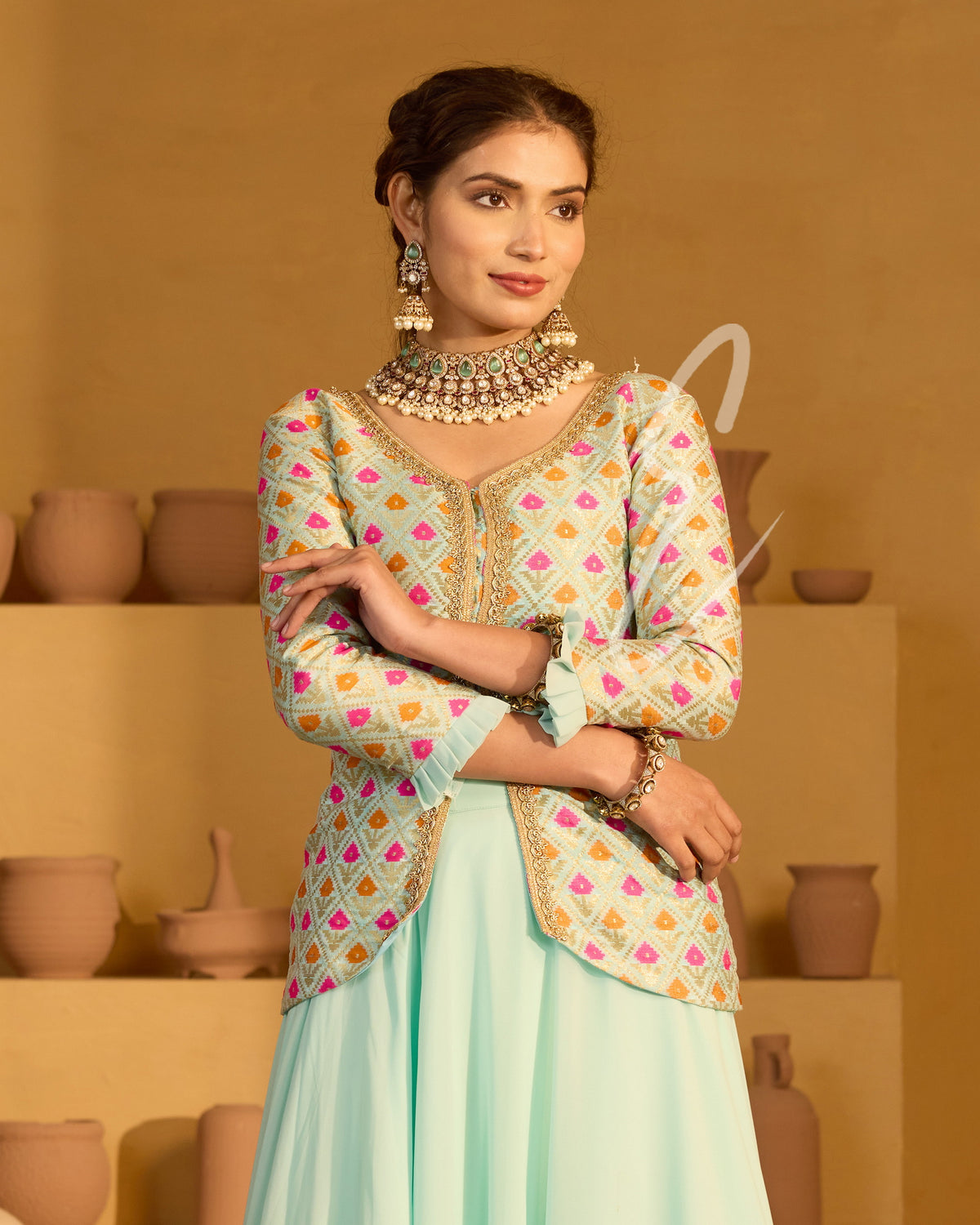 A graceful aqua blue outfit featuring a flowing georgette skirt