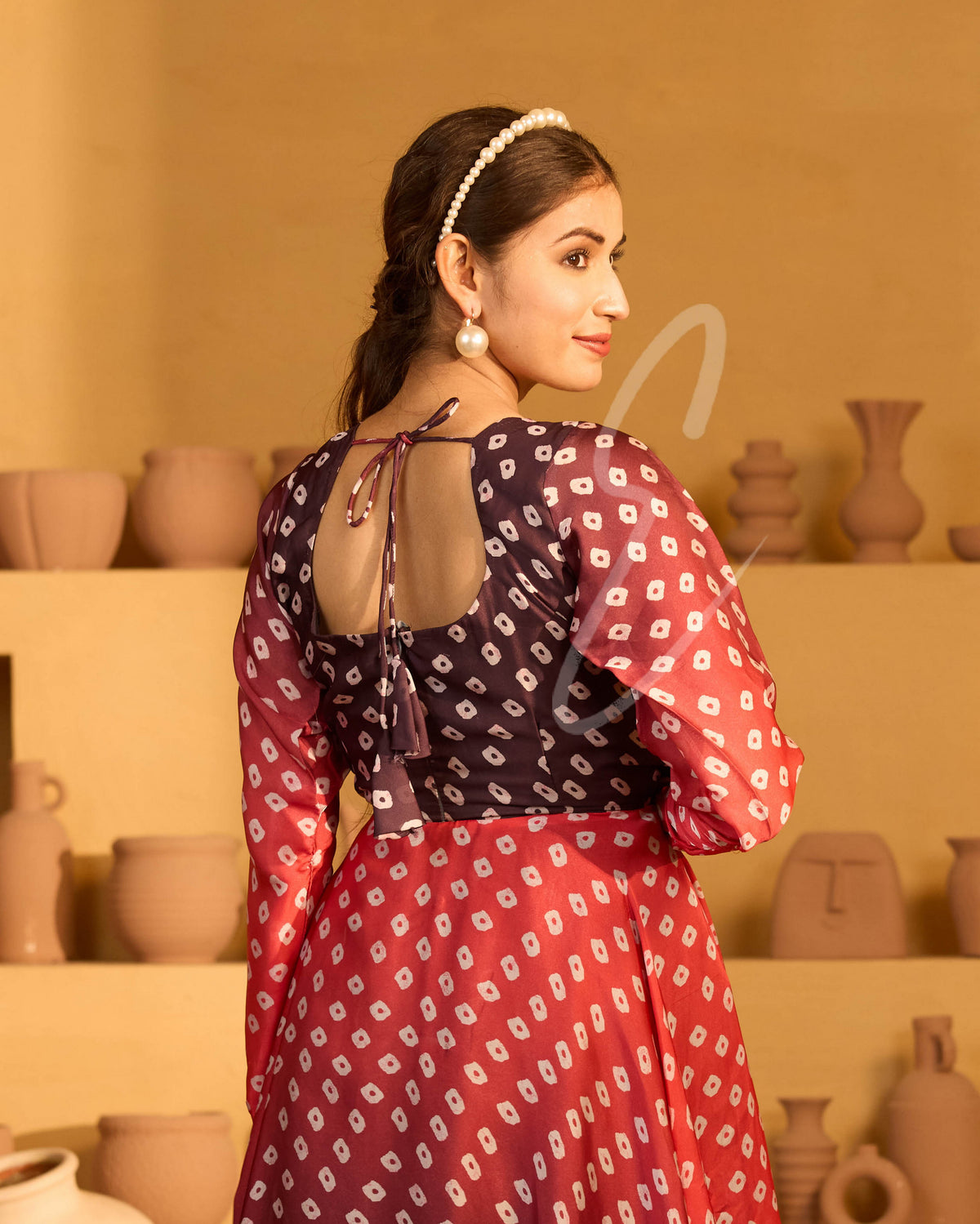 A red and dark brown satin georgette gown