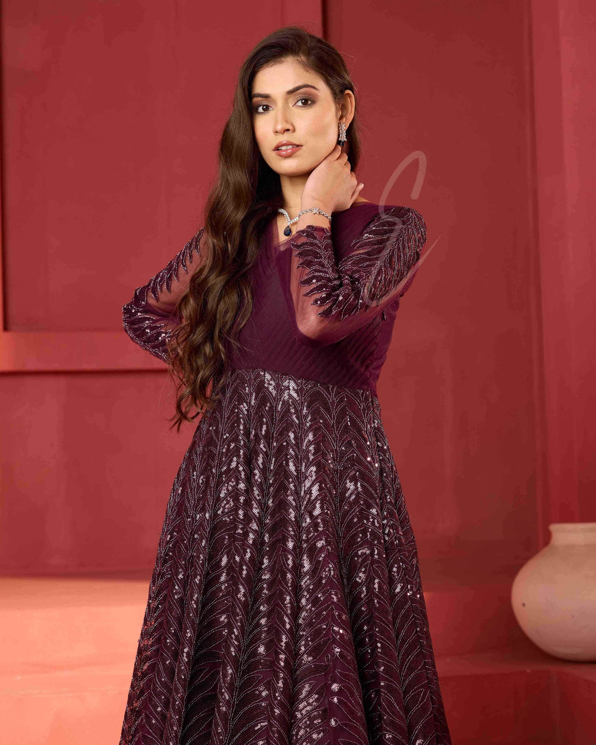 A wine-coloured premium net gown