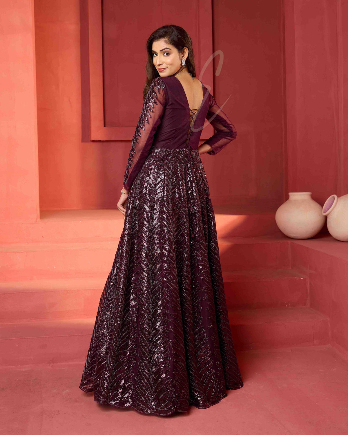 A wine-coloured premium net gown