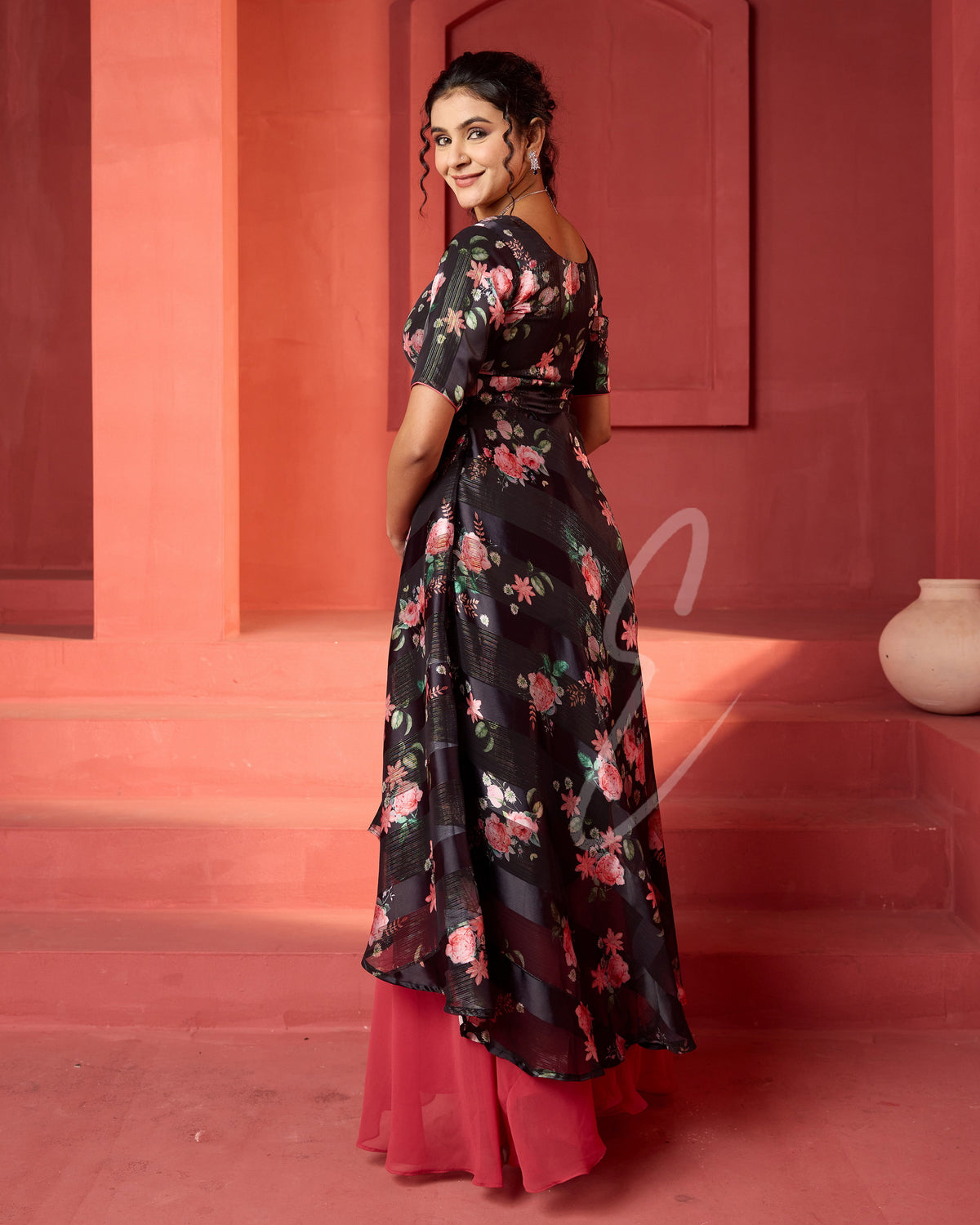 A flowy deep onion pink georgette plaza paired with a black printed georgette satin long coat