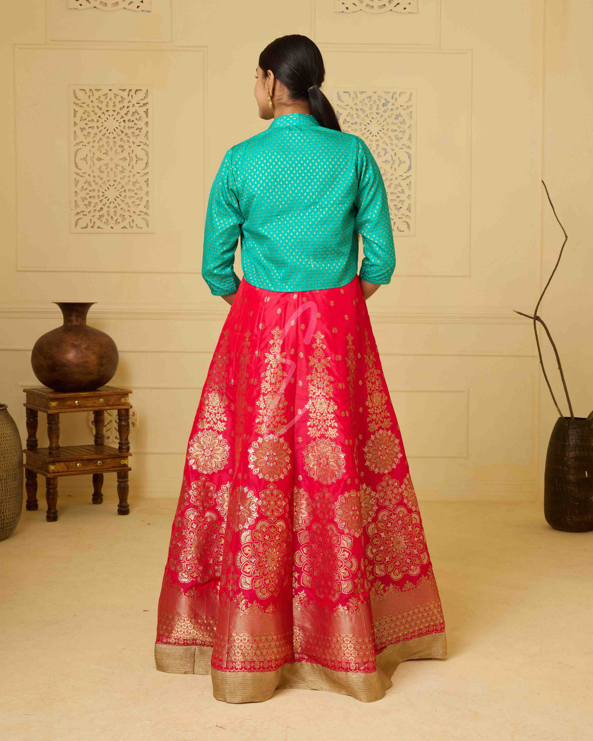 A deep pink Banarasi silk gown