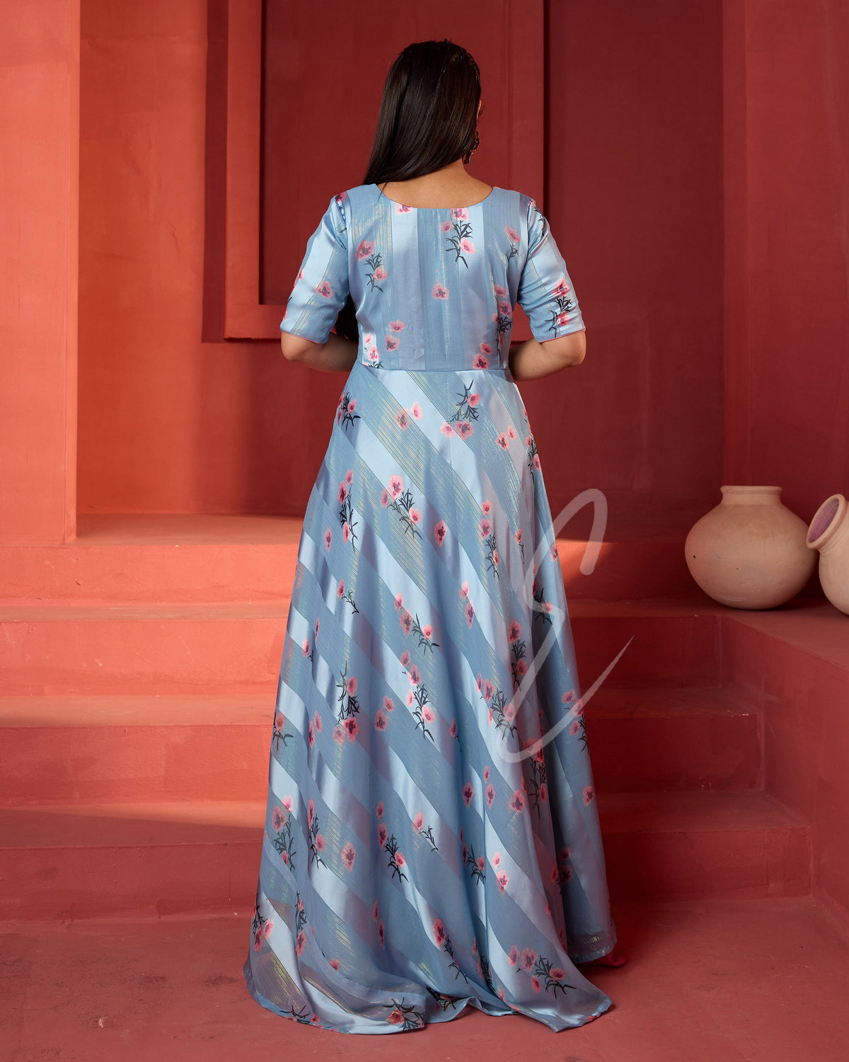A powder blue printed long coat-style top paired with a flowy mild pink palazzo
