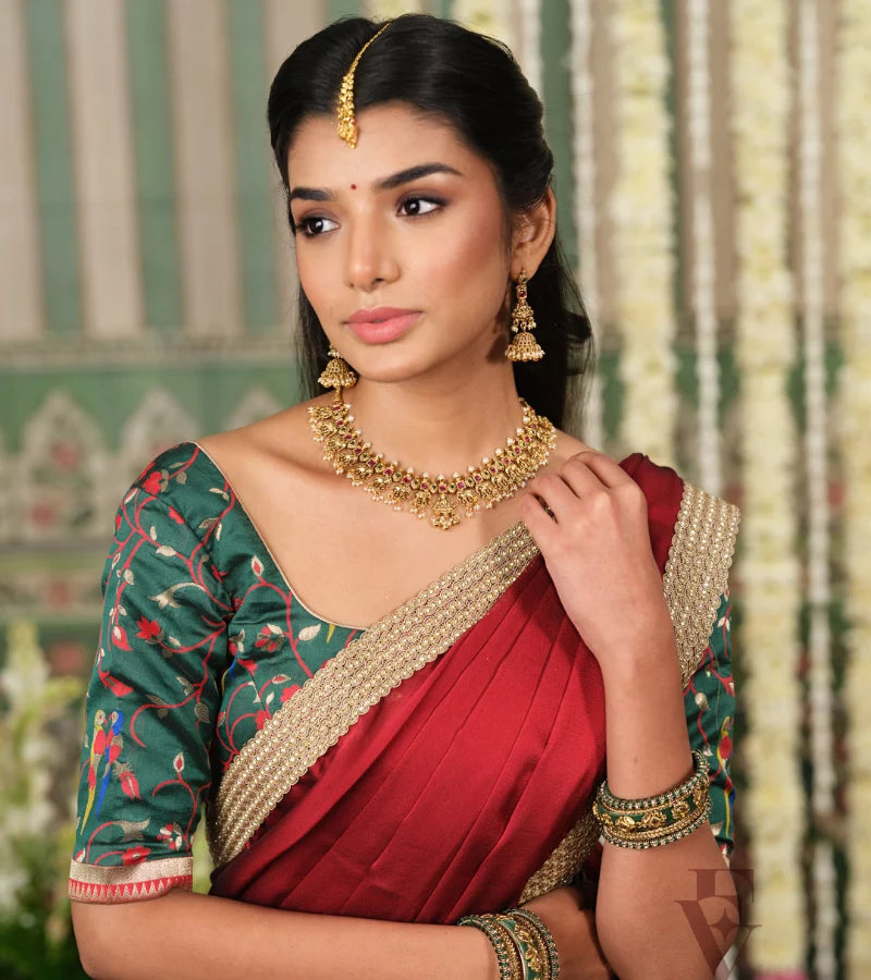 rich dark green Banarasi silk half saree with intricate maroon jari